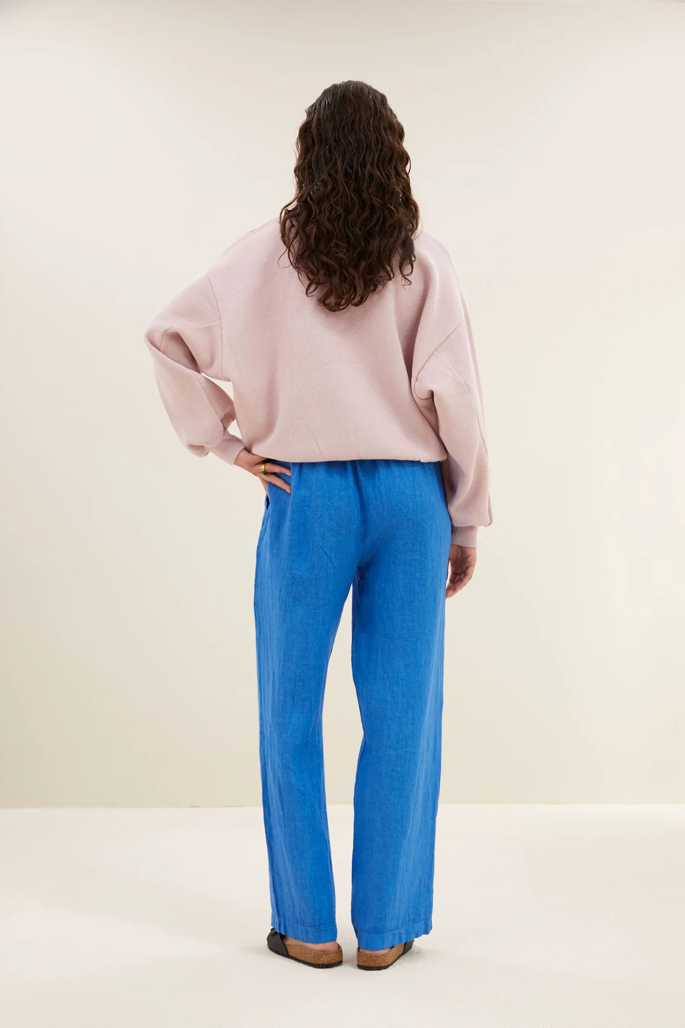 Model wearing the By-Bar robyn linen pants in queens blue. Back view