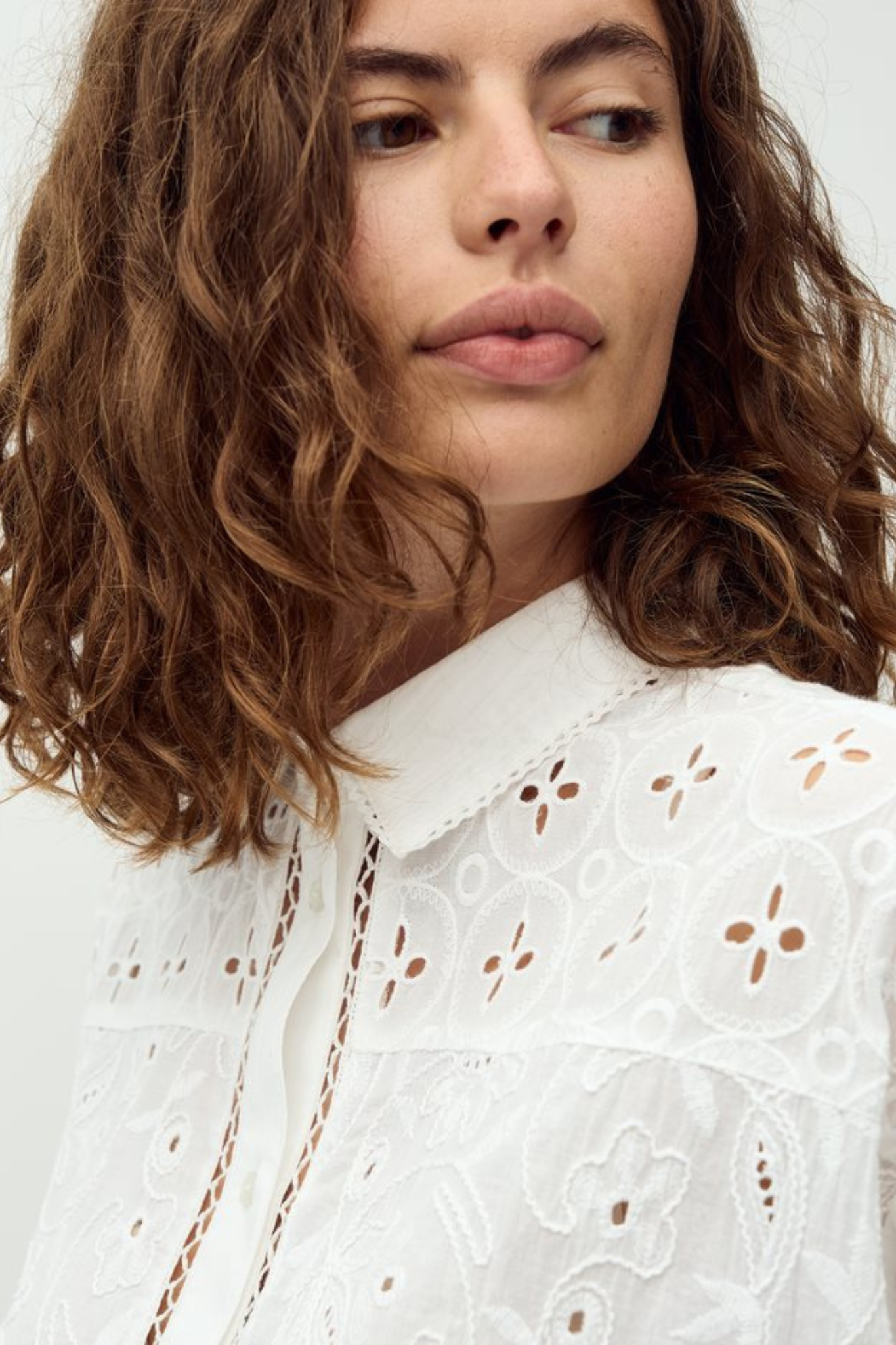 Model wearing the MBYM sonja embroidery shirt in white. Close front view