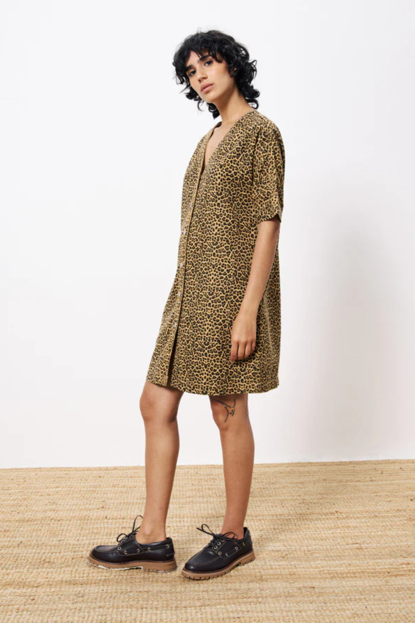 Model wearing the FRNCH aelita dress in leopard. Side view