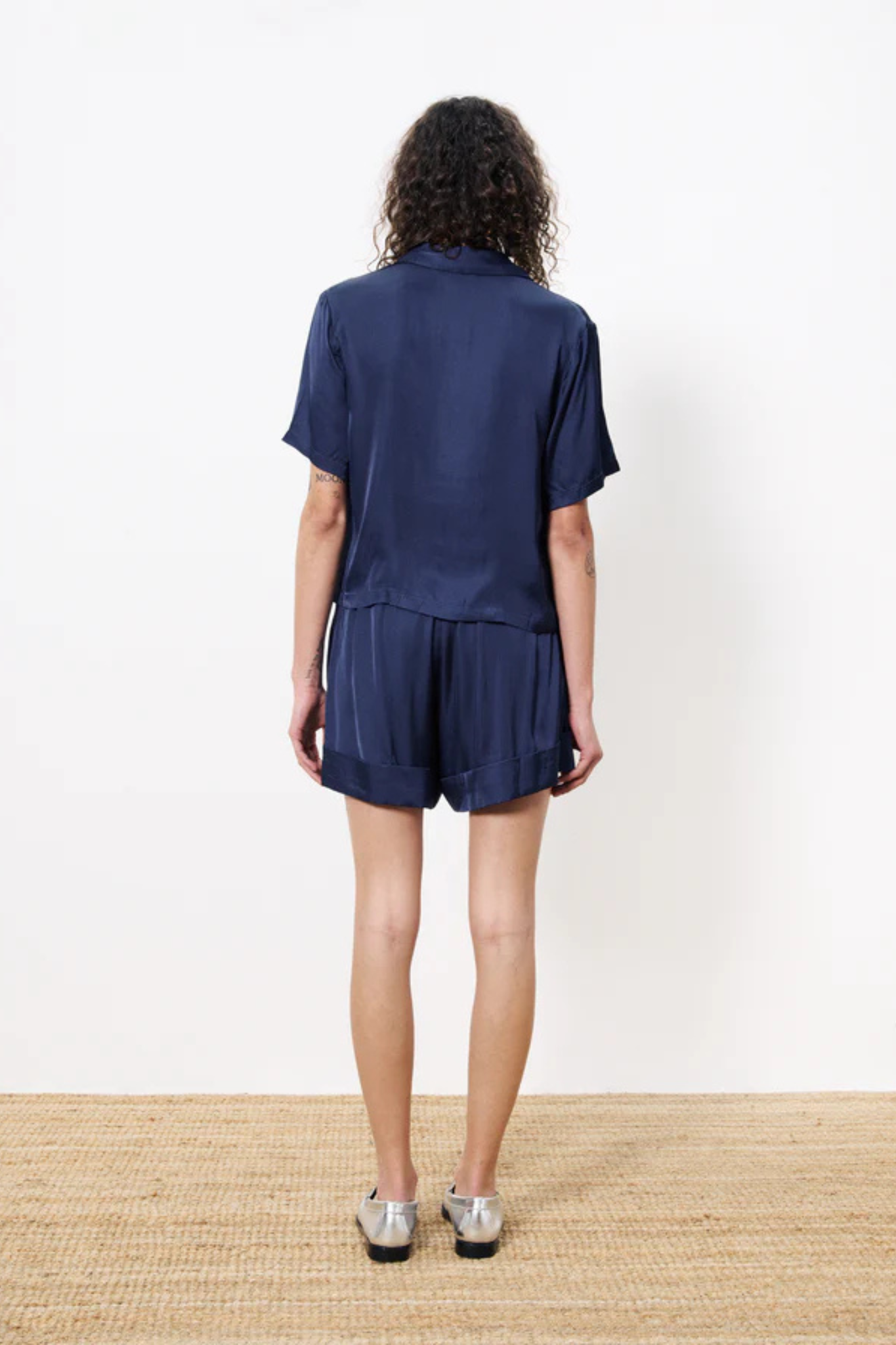 Model wearing the FRNCH noelle short in blue. Back view