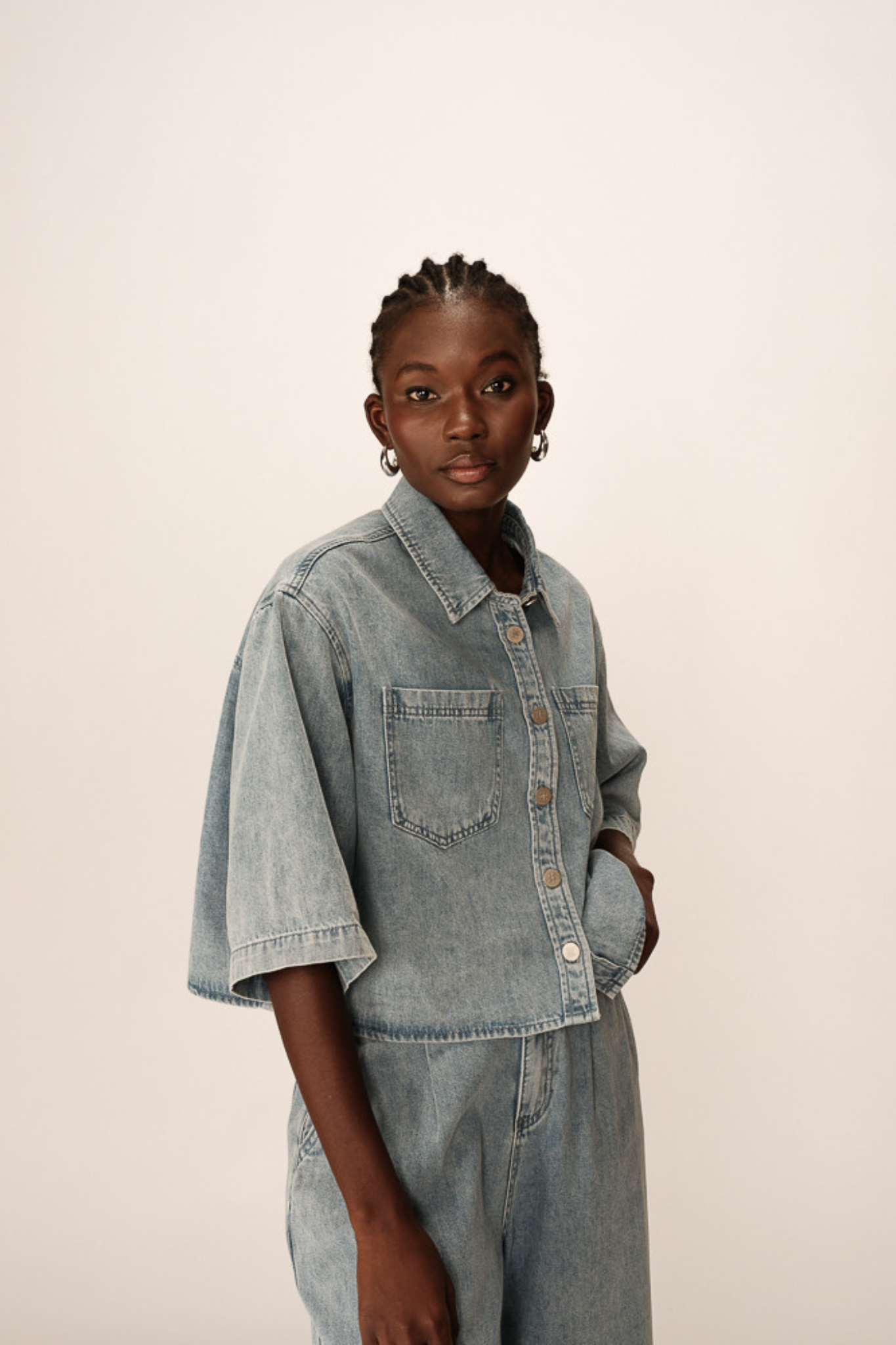 Model wearing the Grace & Mila pomona shirt in denim blue. Front view