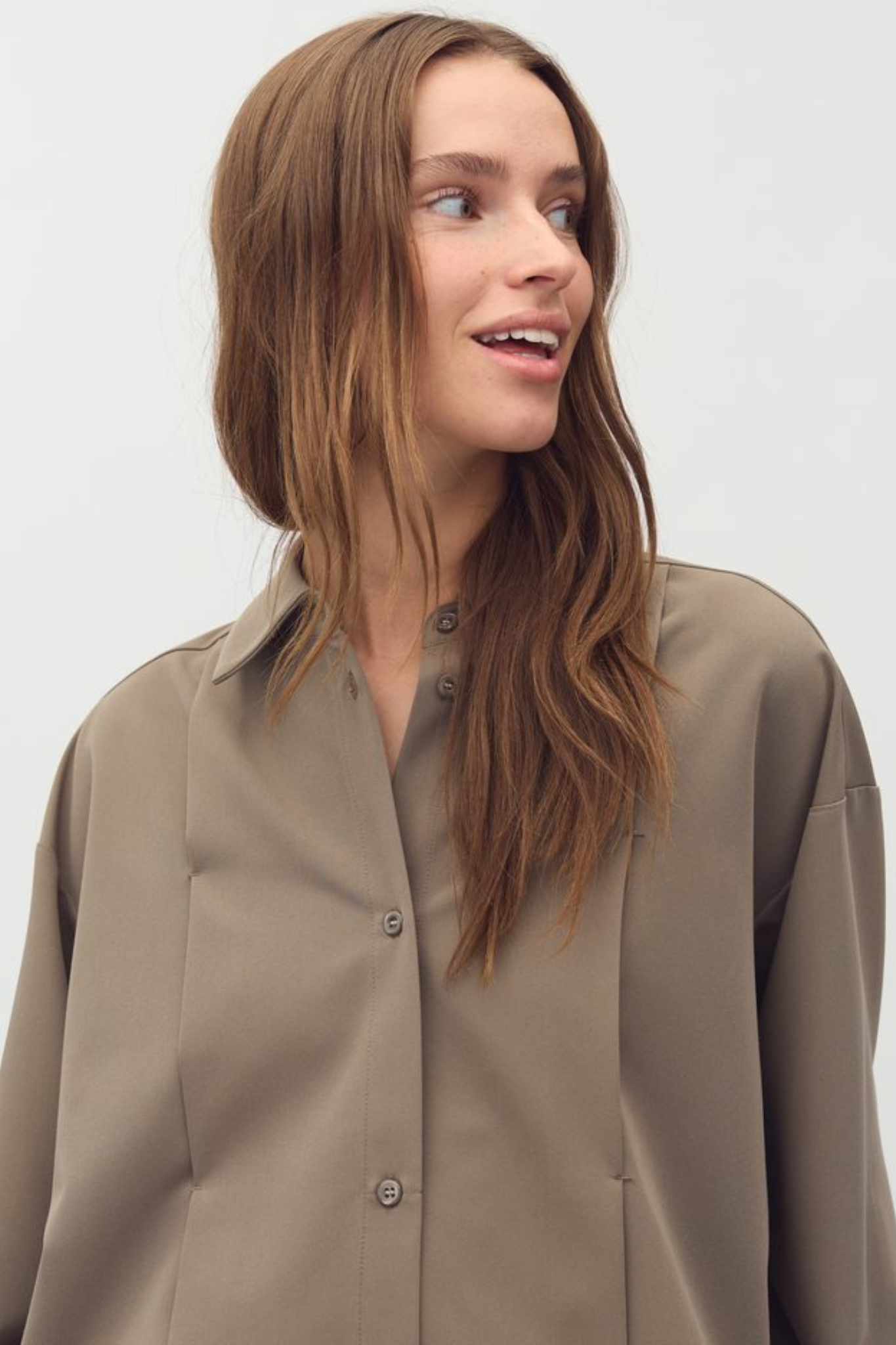 Model wearing the Mbym seppina franky blouse in sand. Close front view