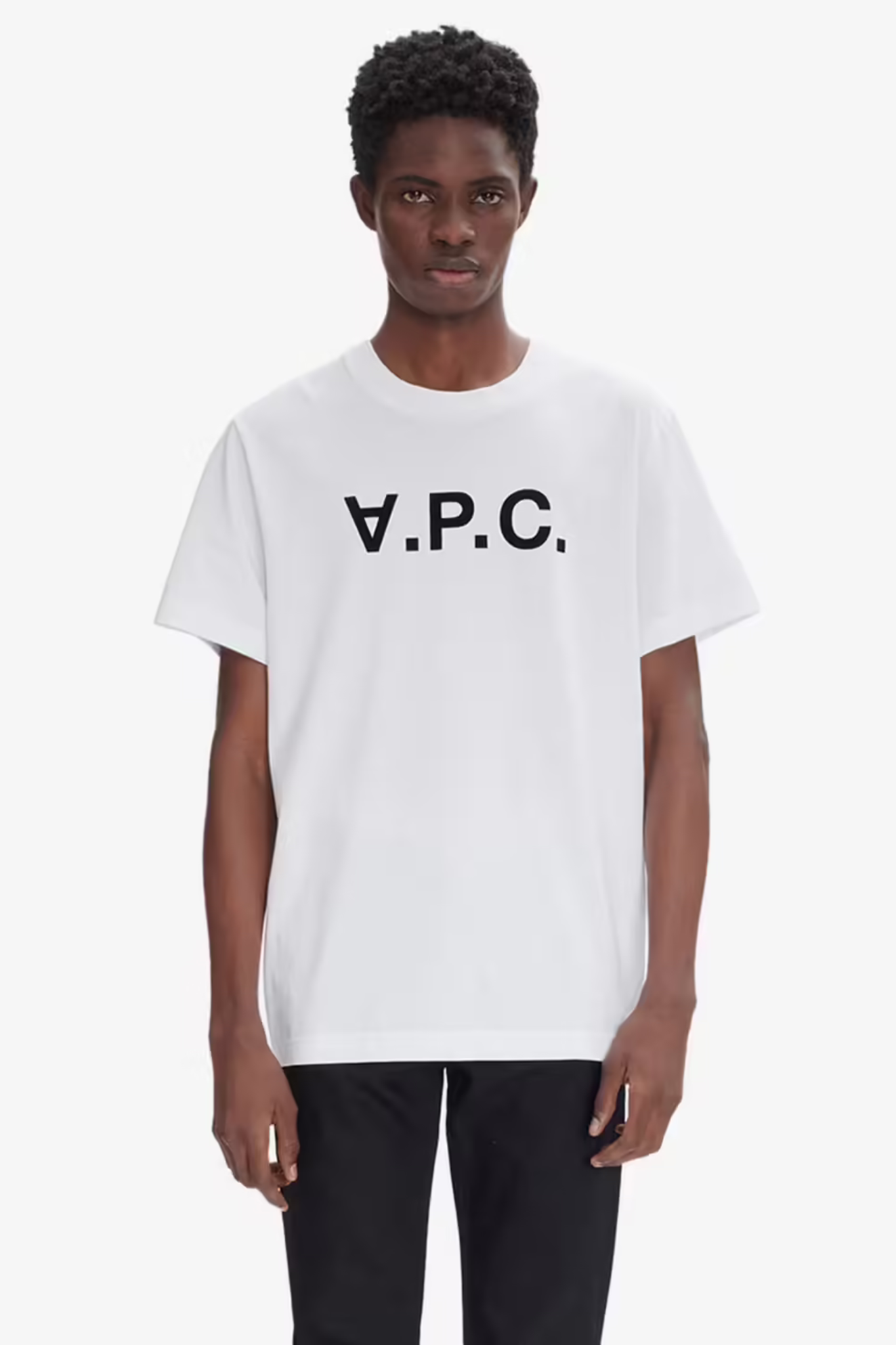 Model wearing the APC white t-shirt with logo in dark navy. Front view