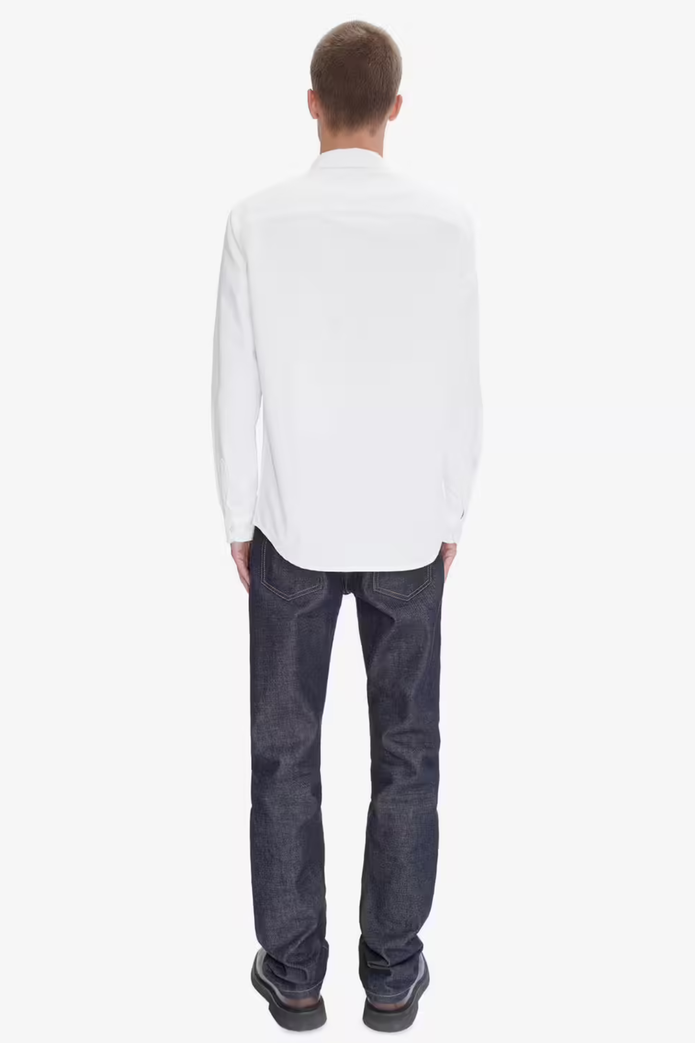 Model wearing the APC greg logo shirt in white. Back view