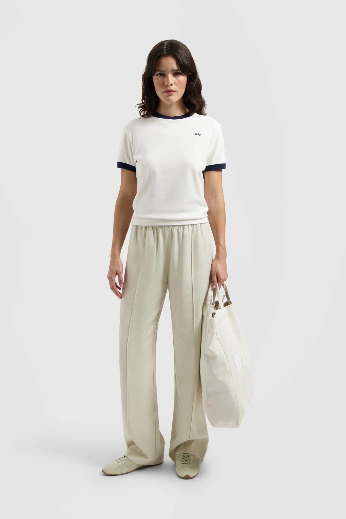 Model wearing the Olaf pintuck elasticated pants in off white. Front view