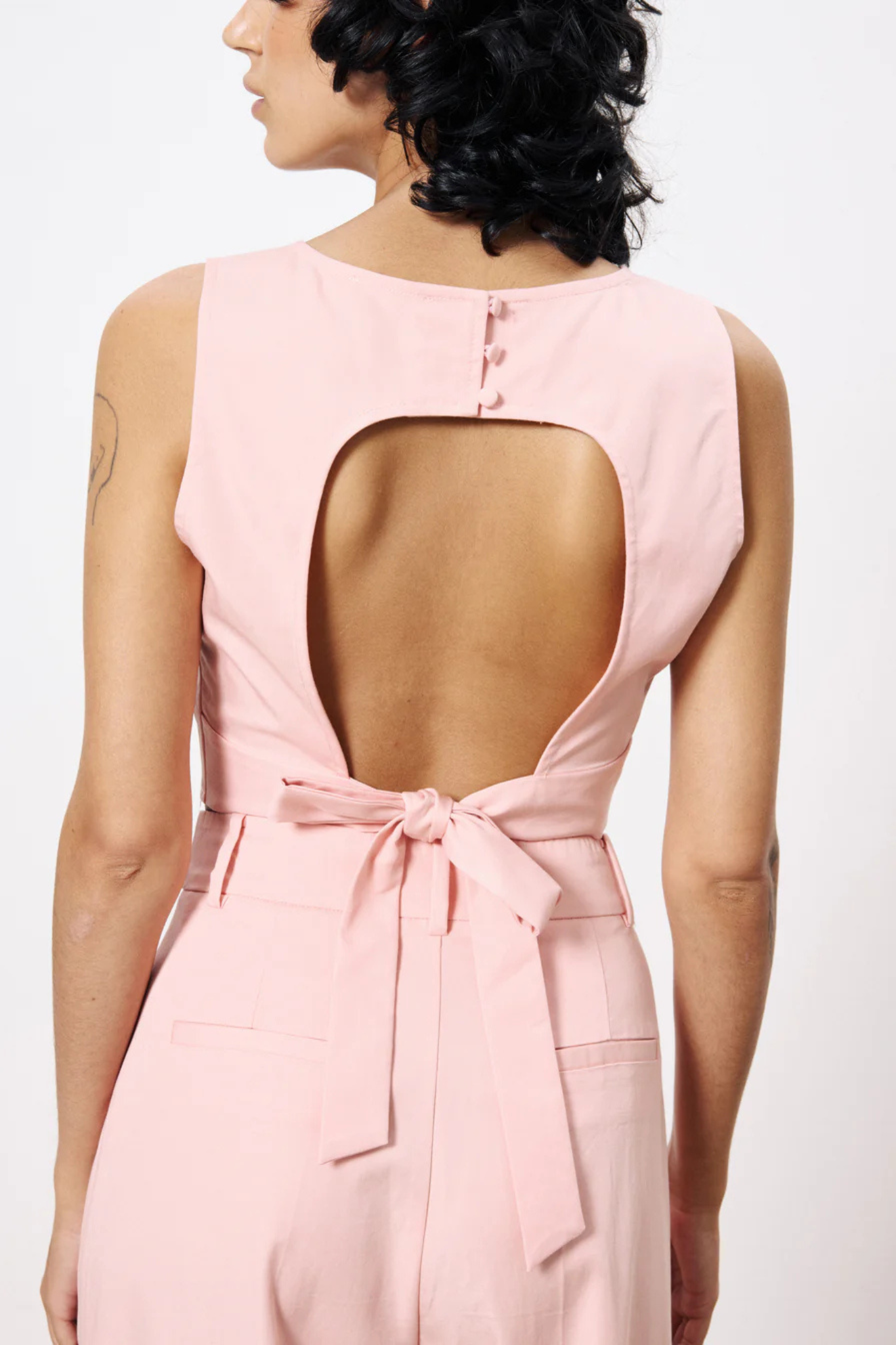 Model wearing the FRNCH lola top in pink. Back view