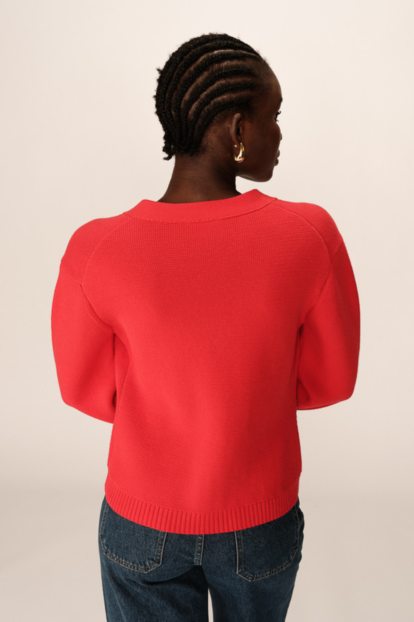 Model wearing the Grace & Mila paolino cardigan jacket in red. Back view