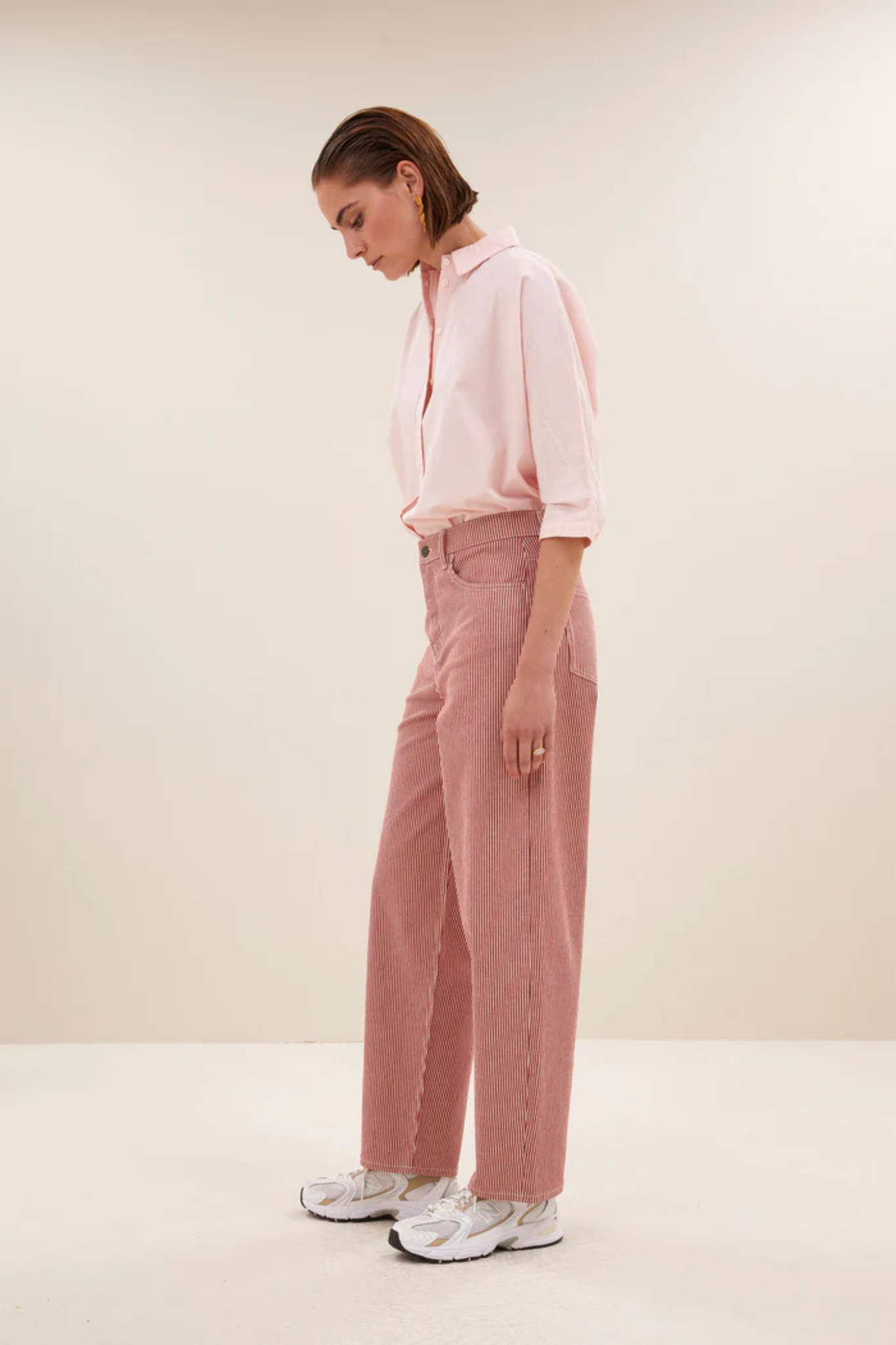 Model wearing the By-Bar norel chambray blouse in light pink. Side view