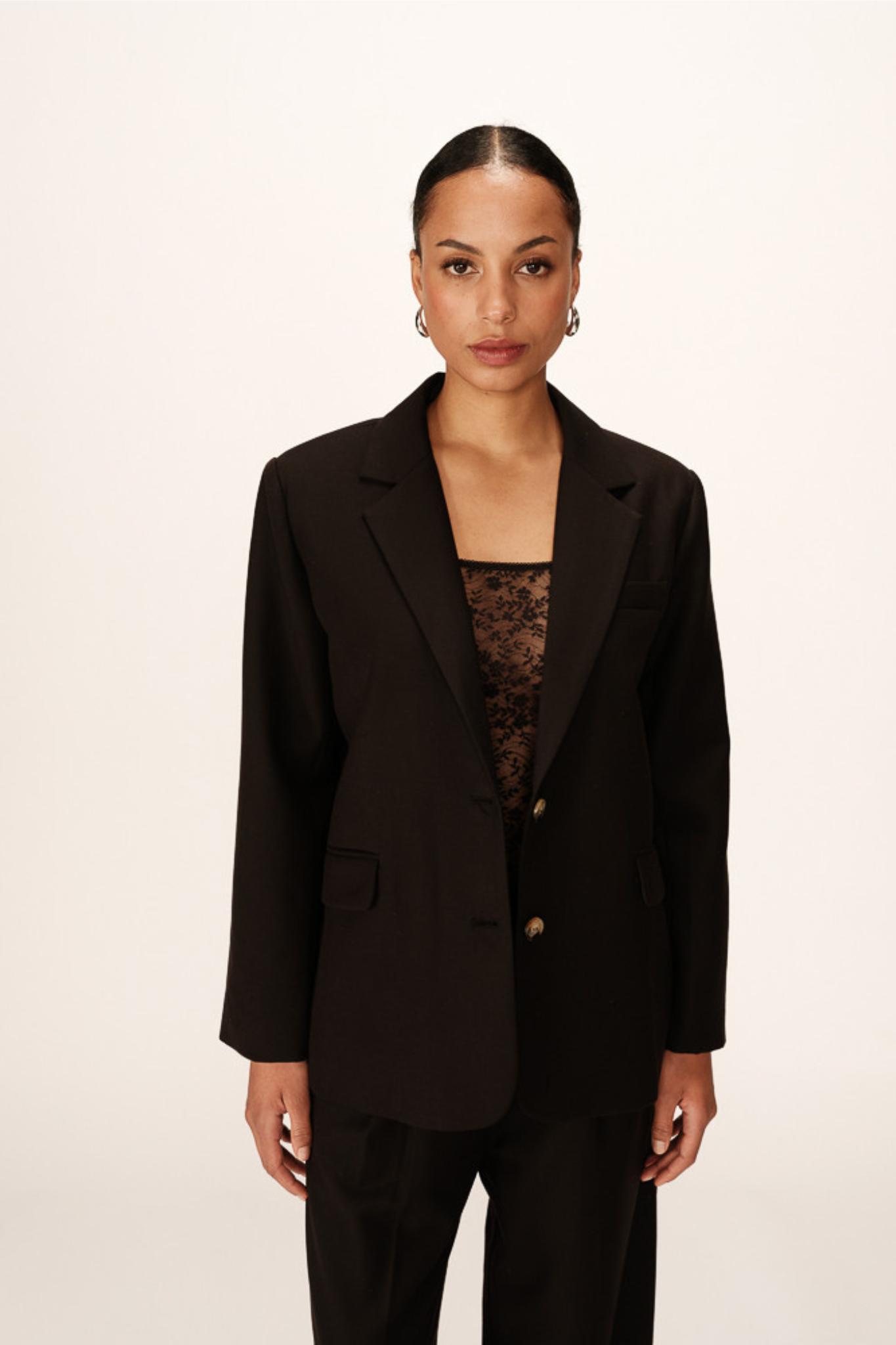 Model wearing the Grace & Mila philippe blazer in black. Front view