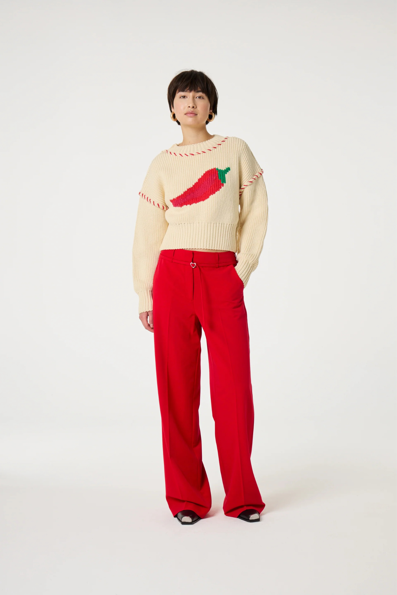 Model wearing the Fabienne Chapot Nelsan pants in red. Front view