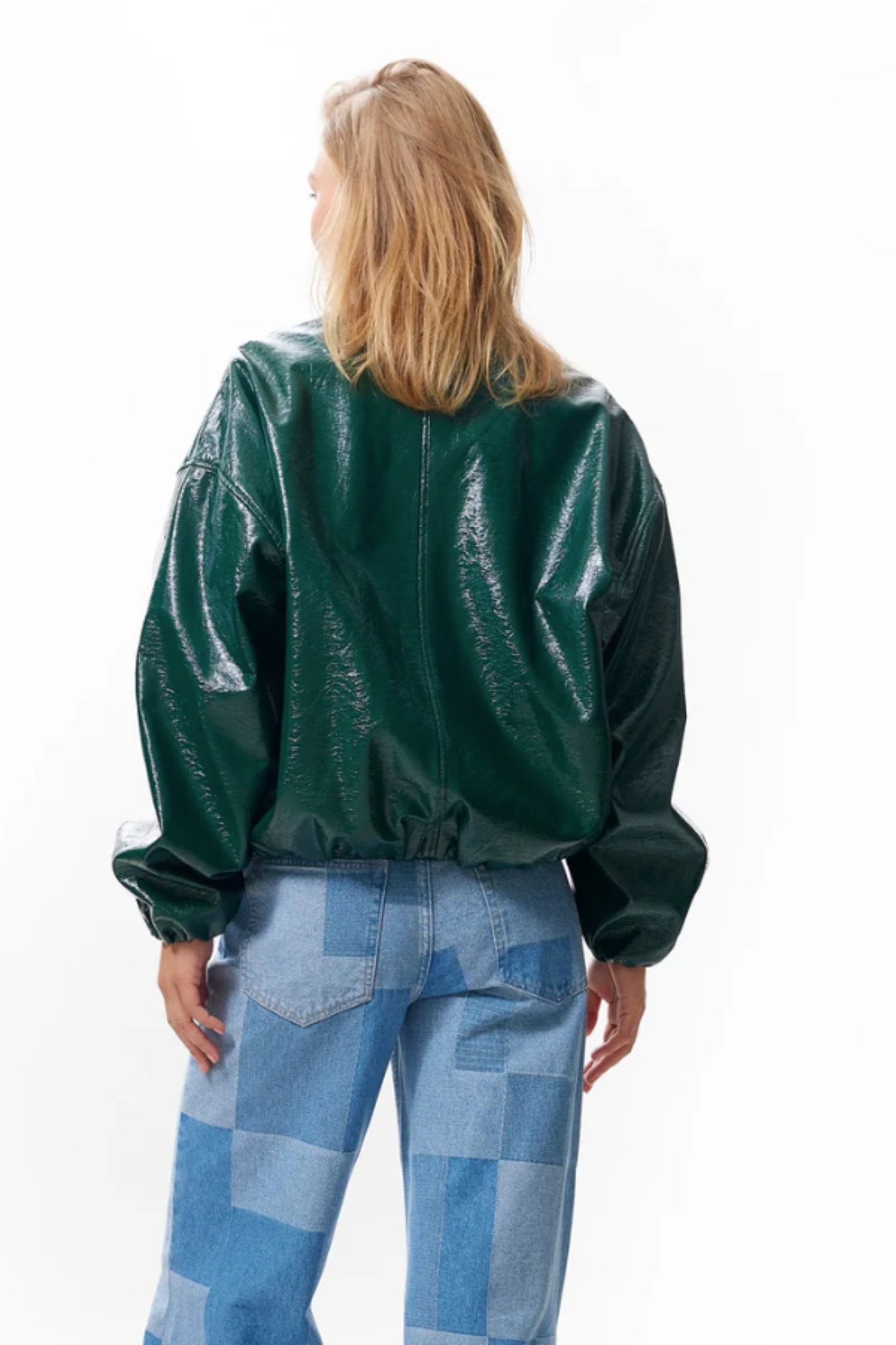 Model wearing the Catwalk Junkie tuck in varsity jacket in green. Back view