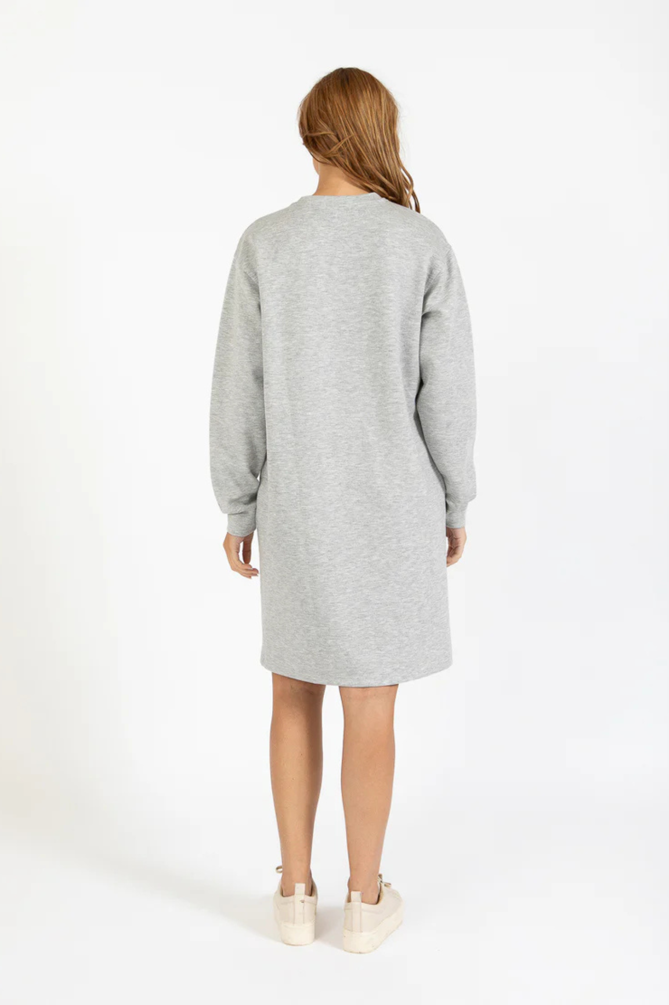 Model wearing the CC Heart Billie sweat dress in light grey. Back view