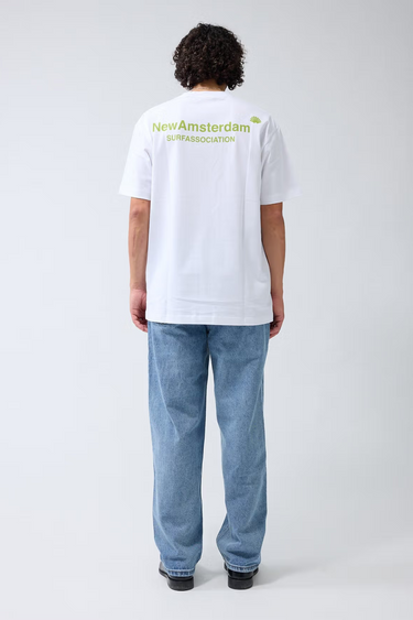 Model wearing the New Amsterdam white logo t-shirt with logo in green. Back view