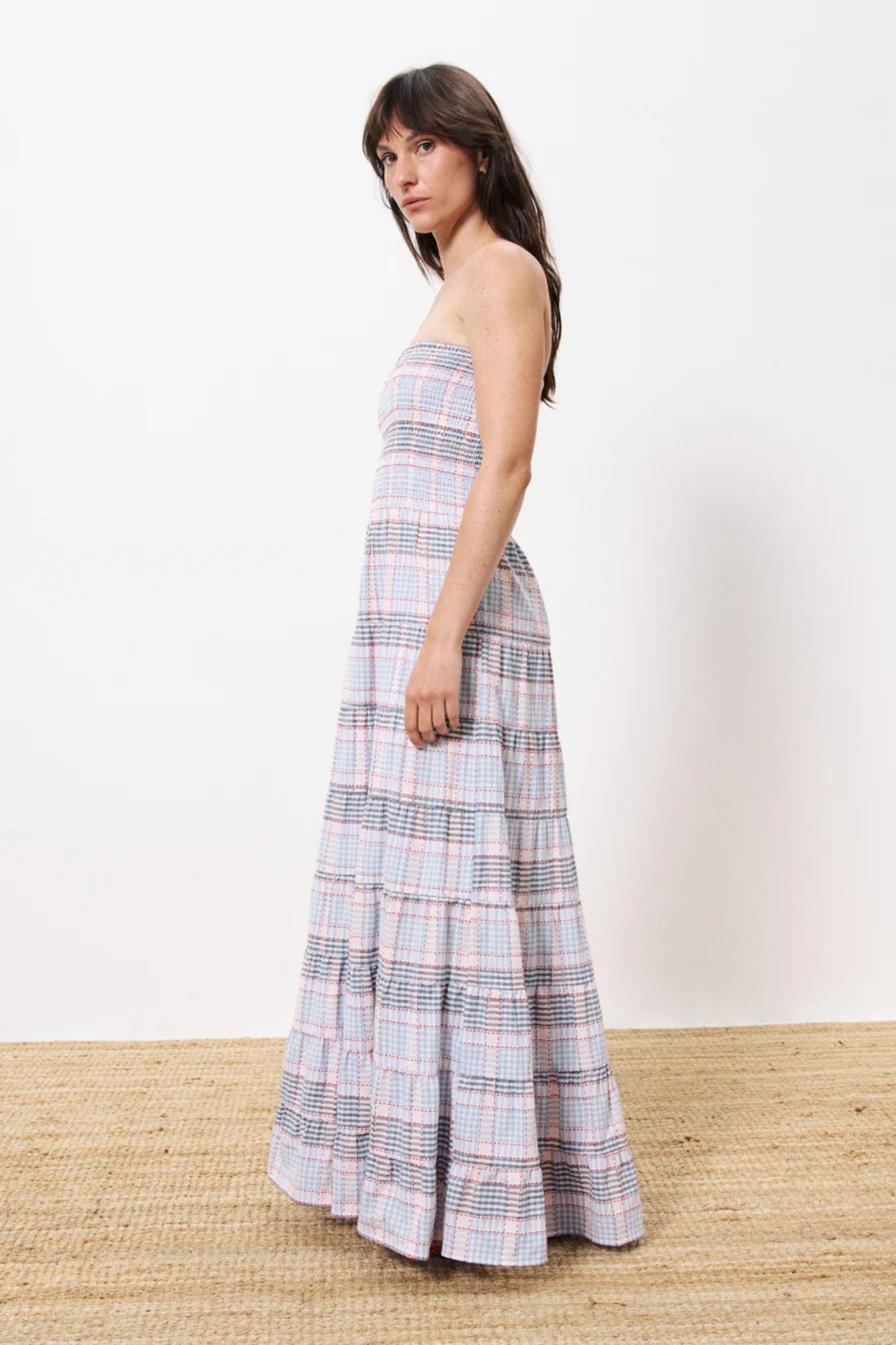 Model wearing the FRNCH dalel dress in light blue checked. Side view