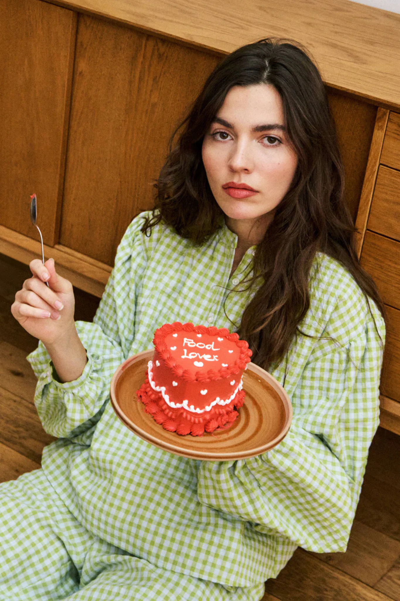 Model wearing the FRNCH noura blouse in green checked. Front view