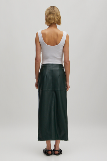 Model wearing the Edited Florin skirt in green. Back view