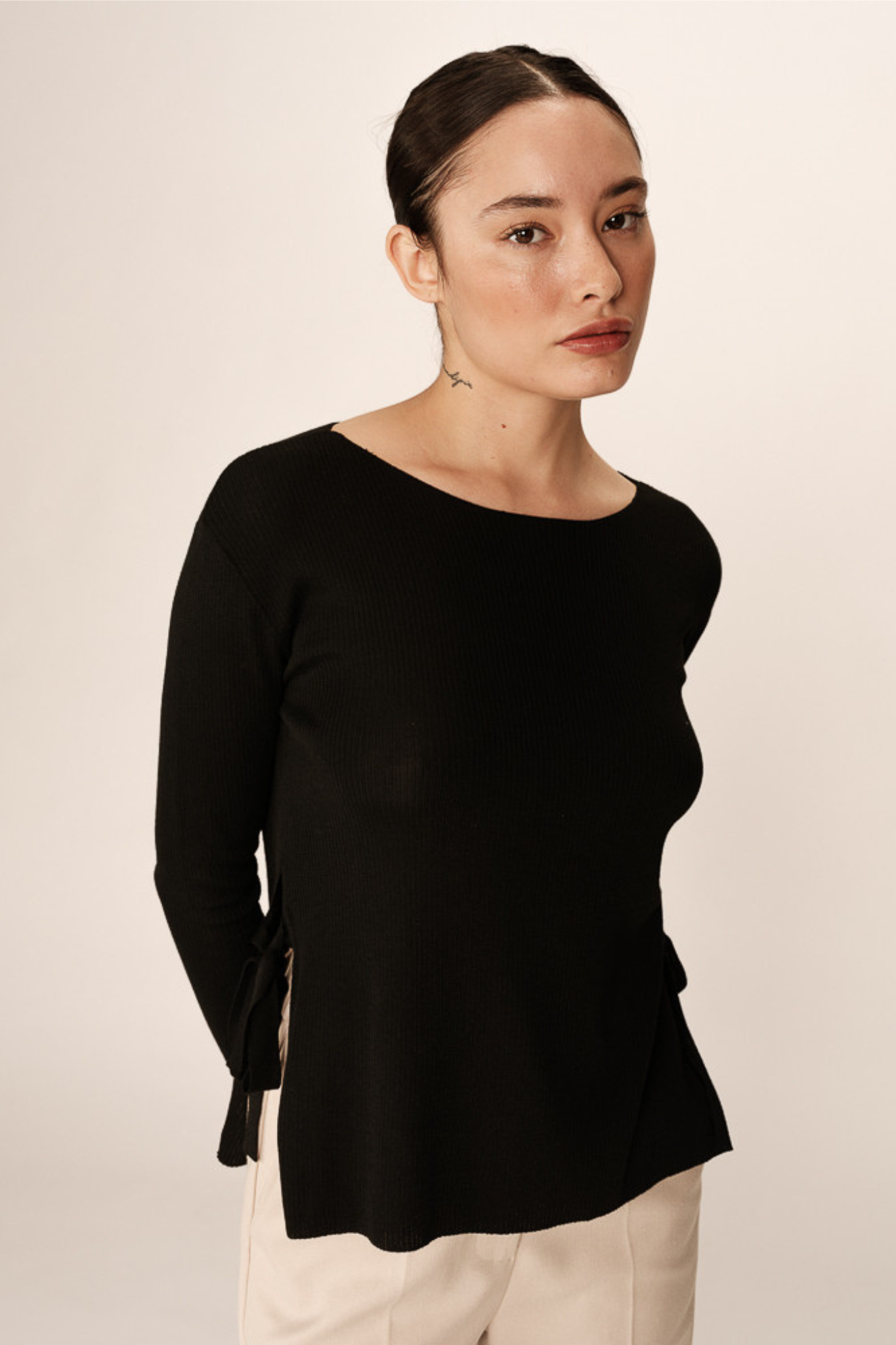 Model wearing the Grace & Mila palmer sweater in black. Front view