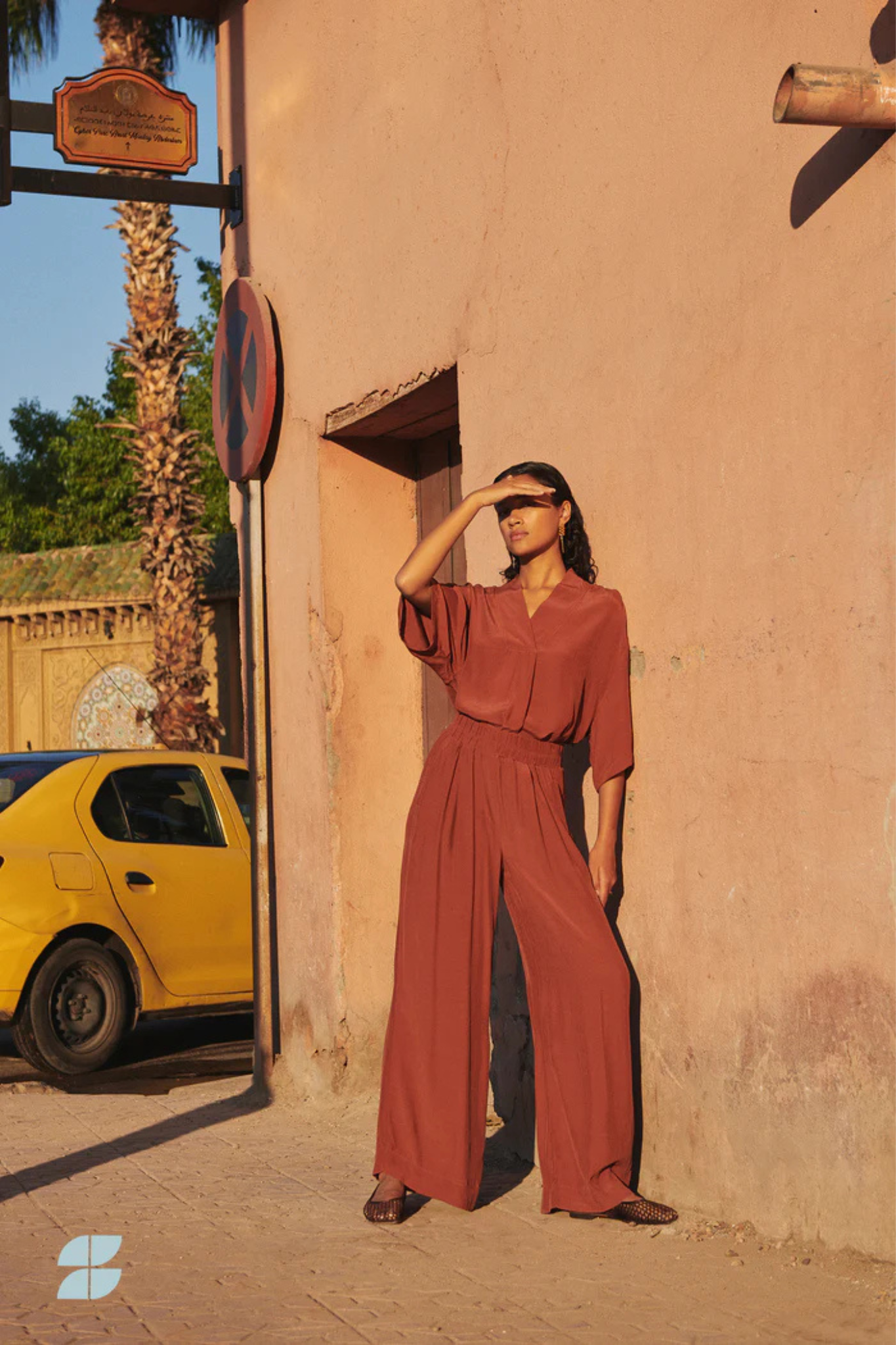 Model wearing the By-Bar owen viscose blouse in brick red. Front view