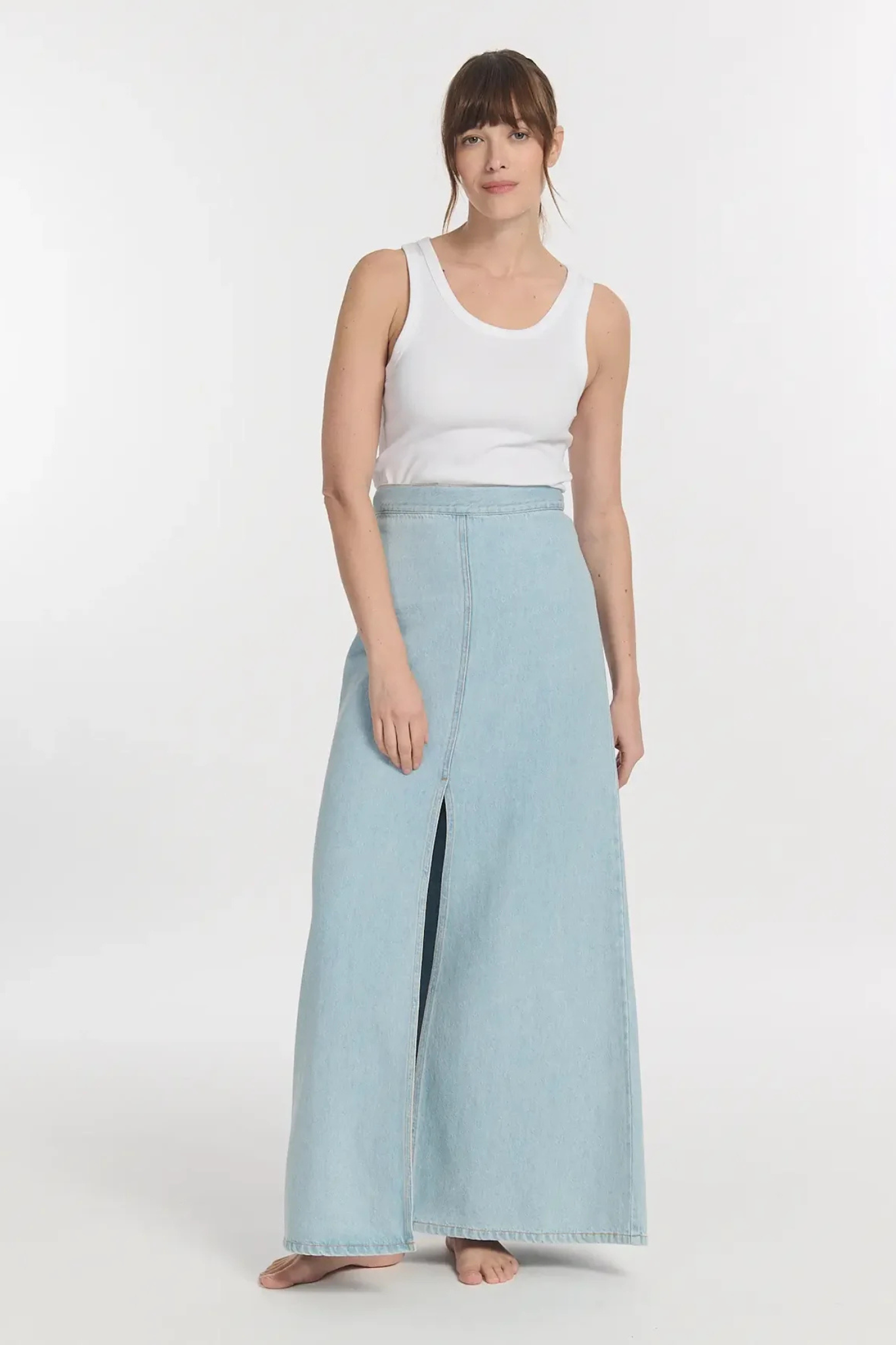 Model wearing the Labdip jodie denim tencel skirt in bleached denim. Front view