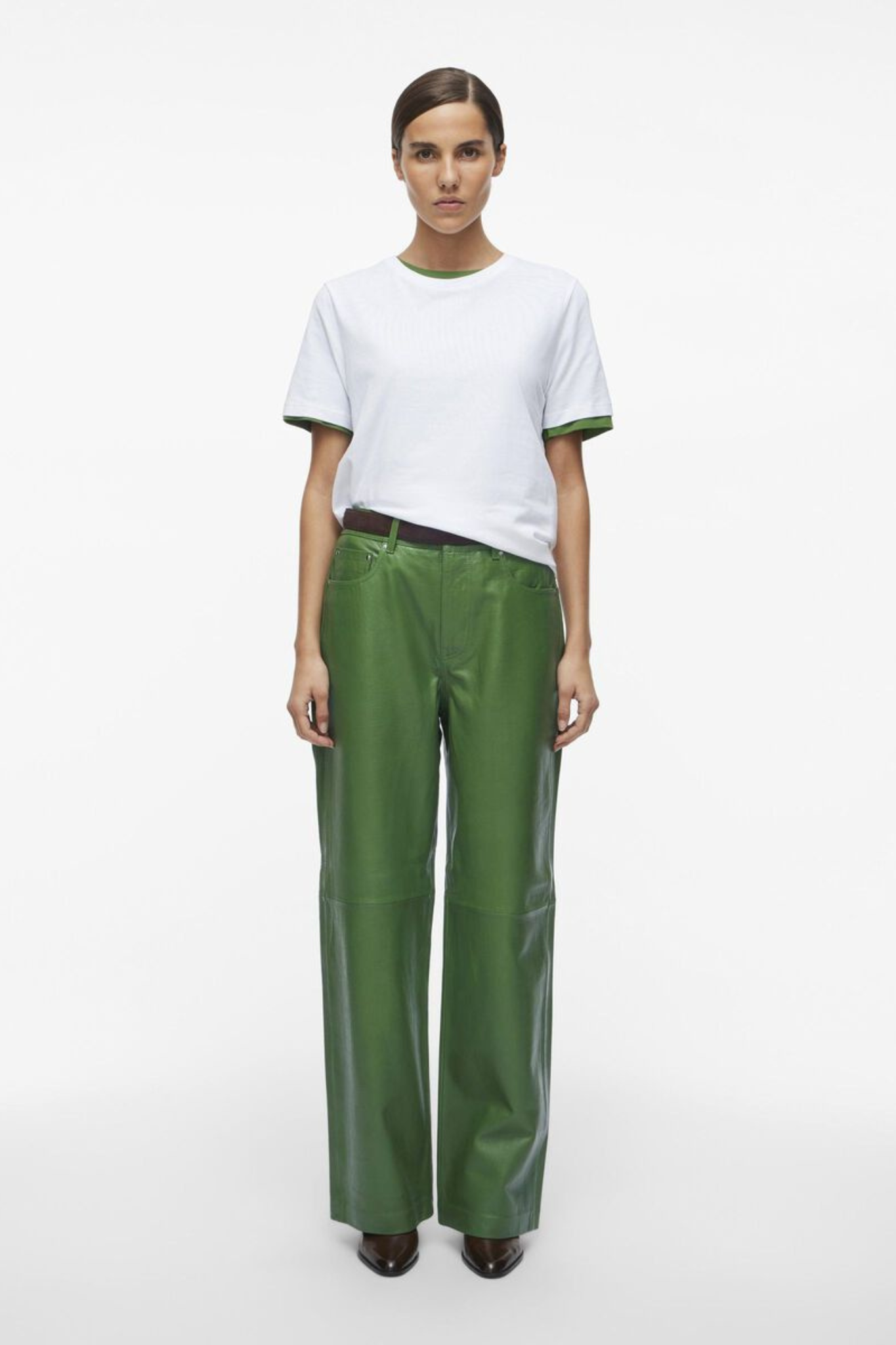 Model wearing the Rouge Edit artichoke green leather pants. Front view