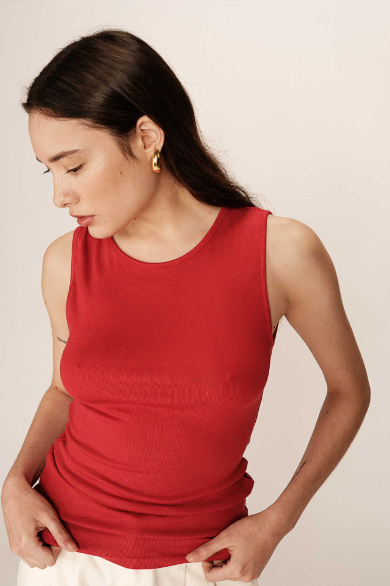 Model wearing the Grace & Mila paulin top in red. Front view