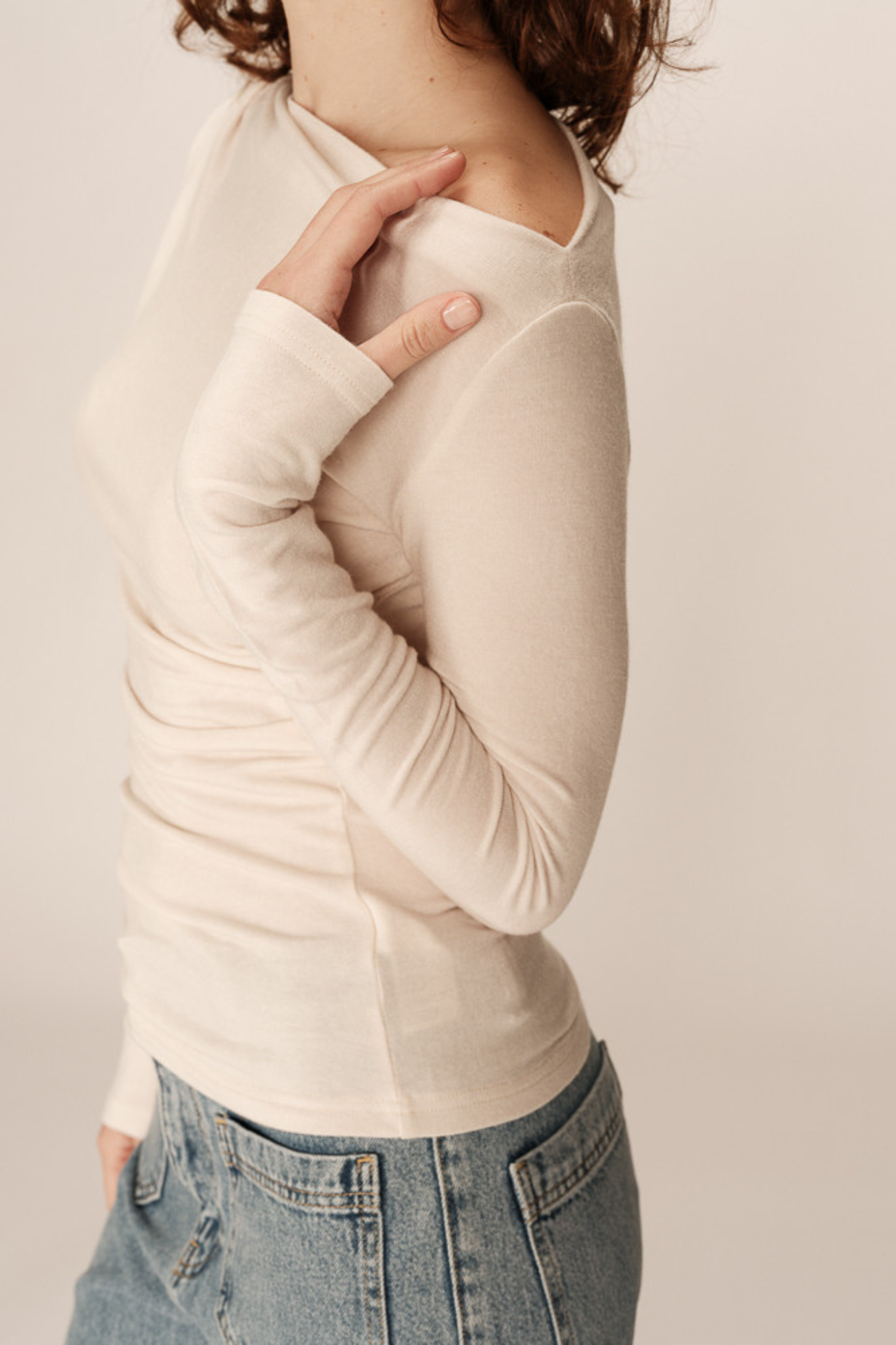 Model wearing the Grace & Mila ponti top in beige. Side view