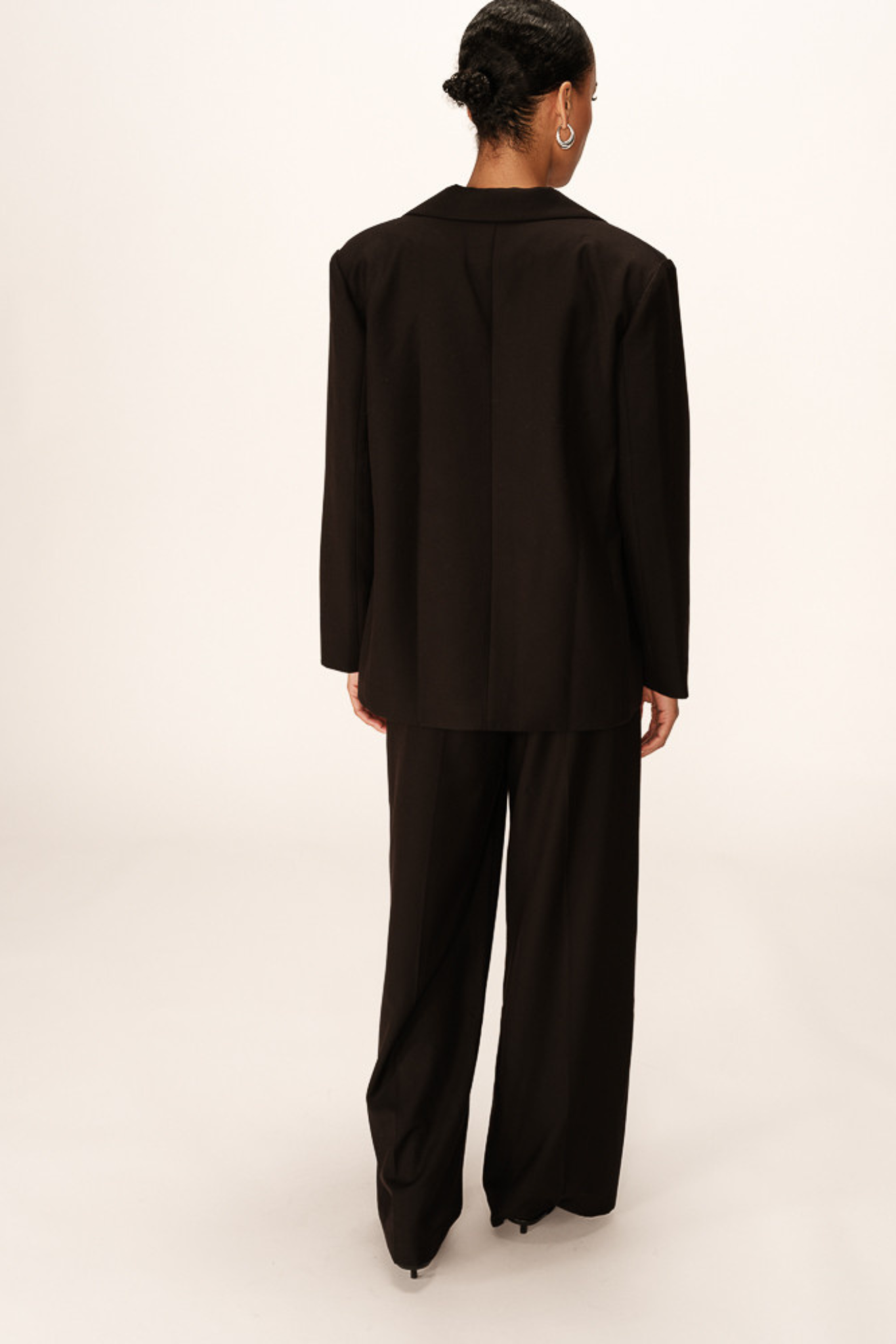 Model wearing the Grace & Mila philippe blazer in black. Back view