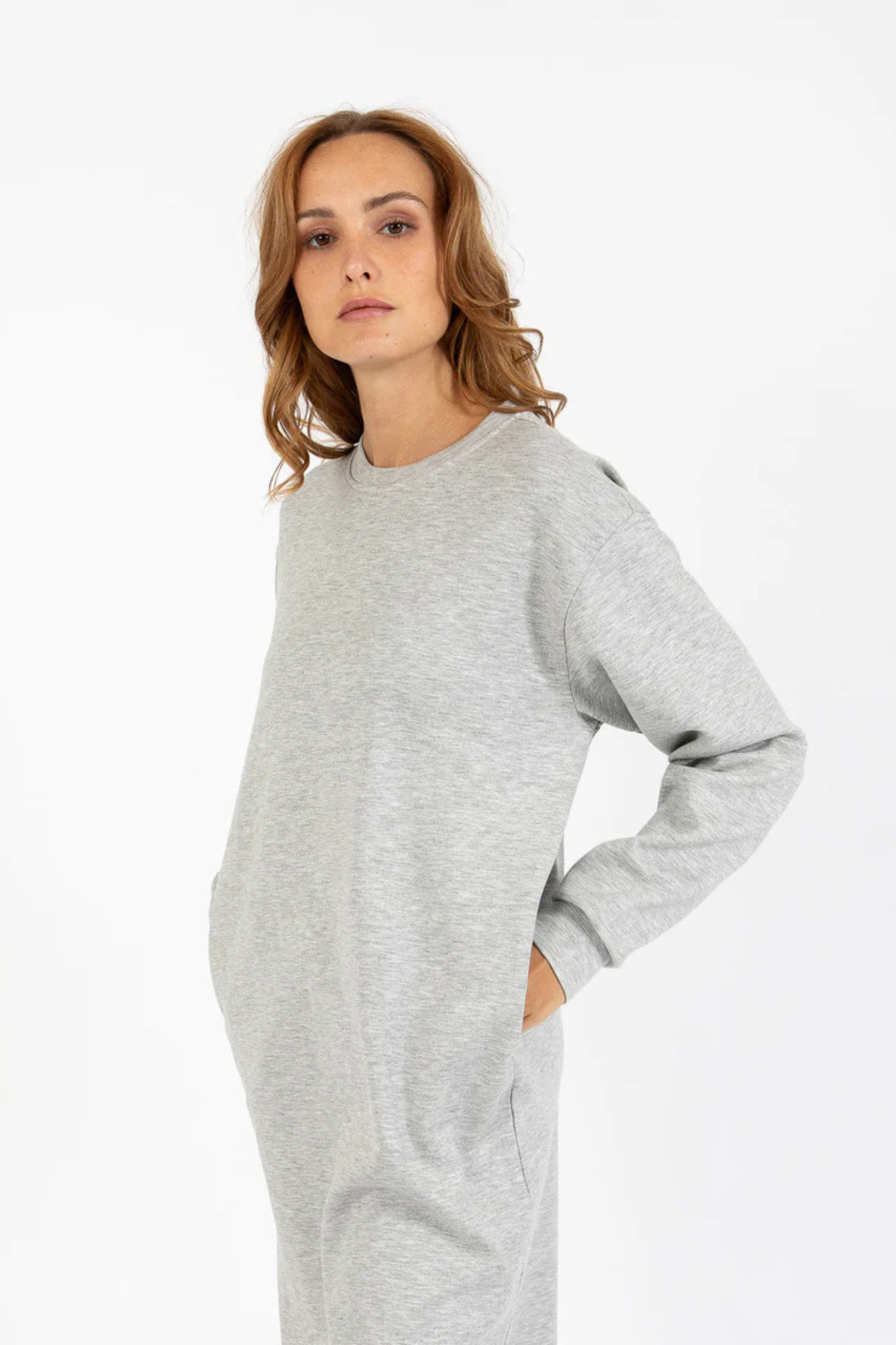 Model wearing the CC Heart Billie sweat dress in light grey. Front view