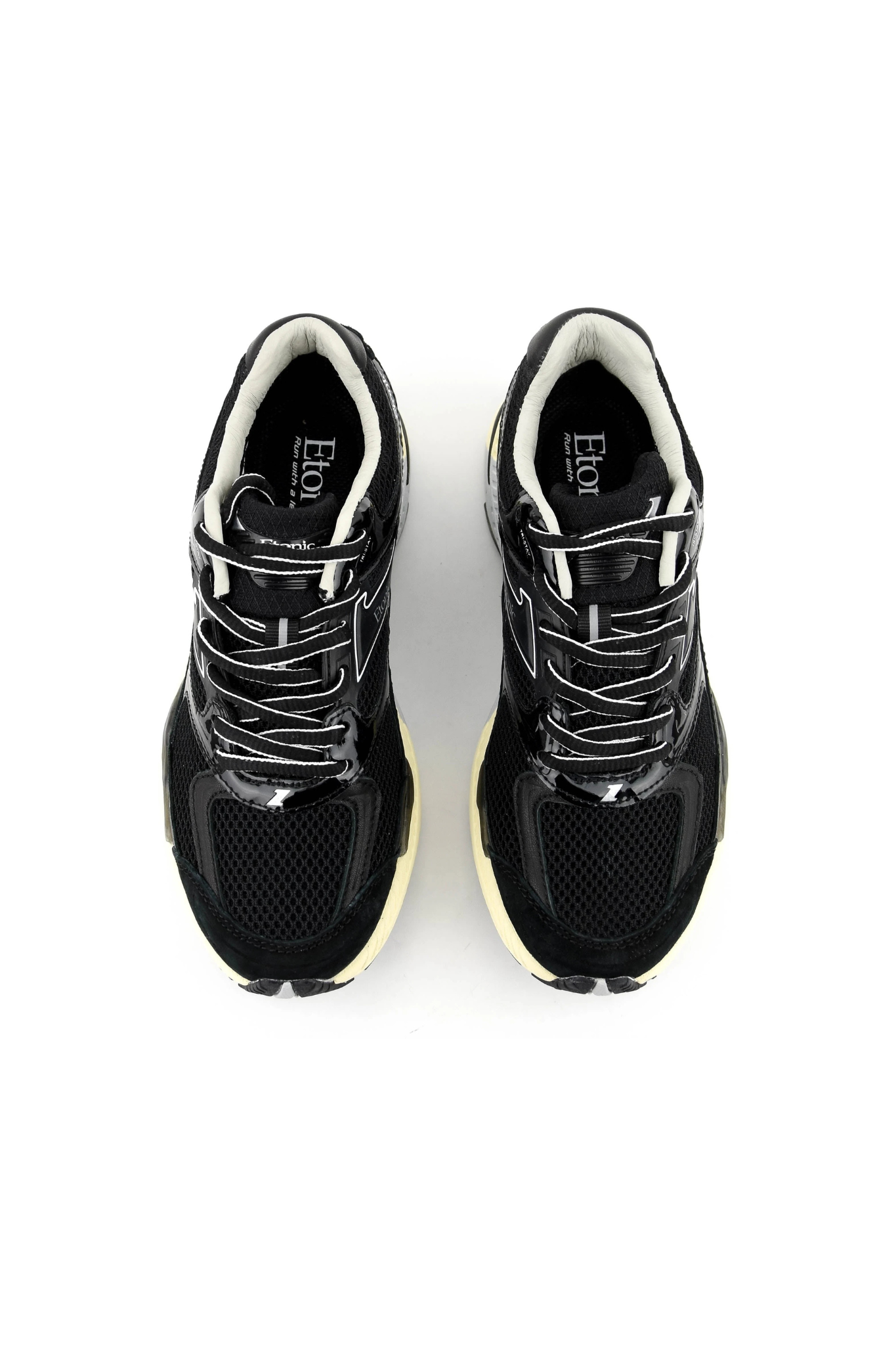 Etonic evolution sneaker in black. Front view