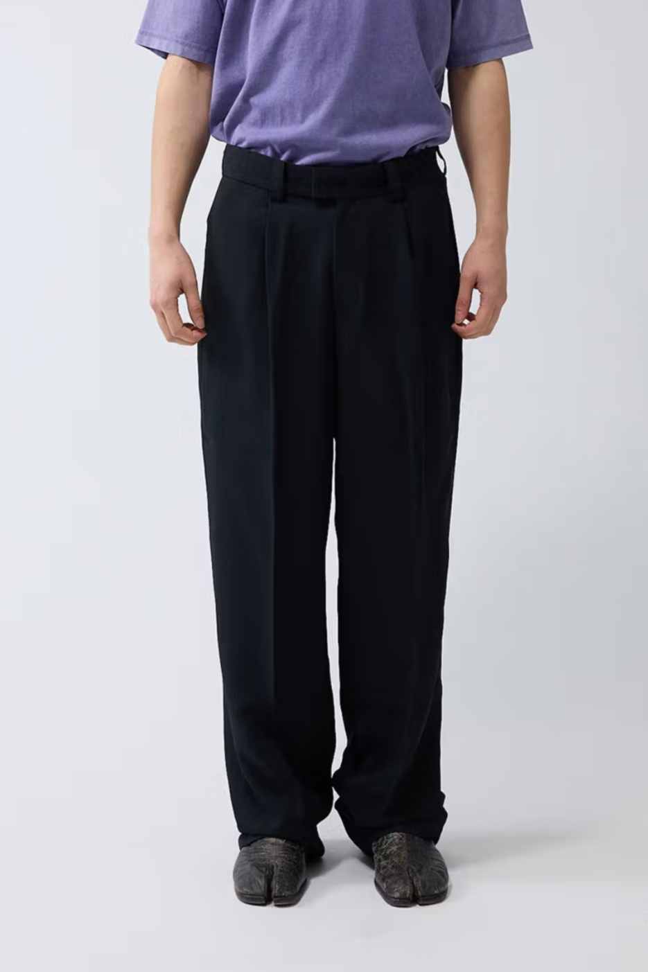 Model wearing the black New Amsterdam wool trousers. Front view