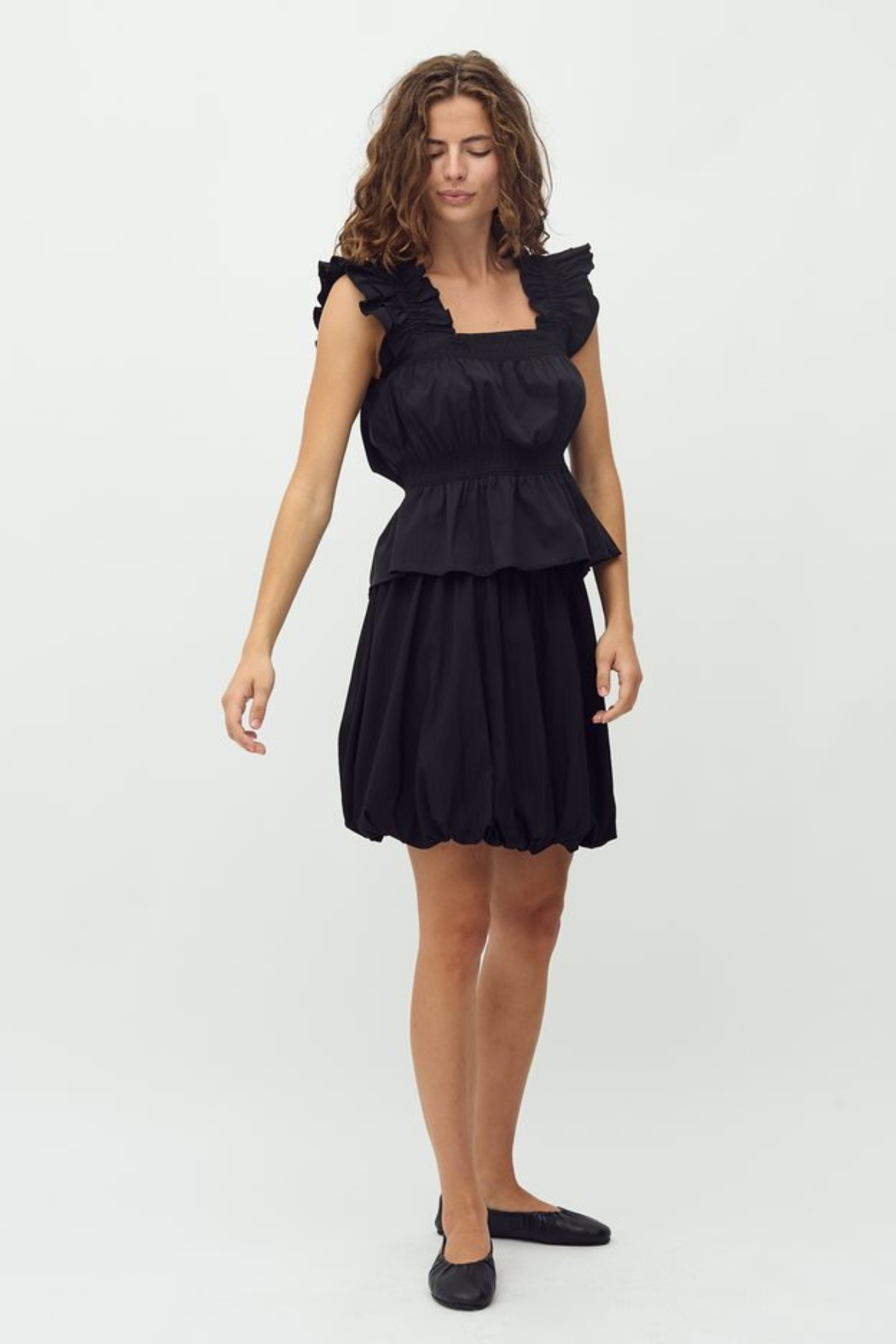 Model wearing the MBYM belaria twilia skirt in black. Front view