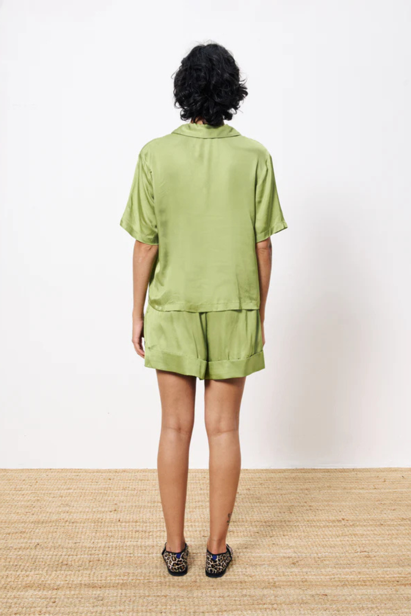 Model wearing the FRNCH chelly shirt in green. Back view