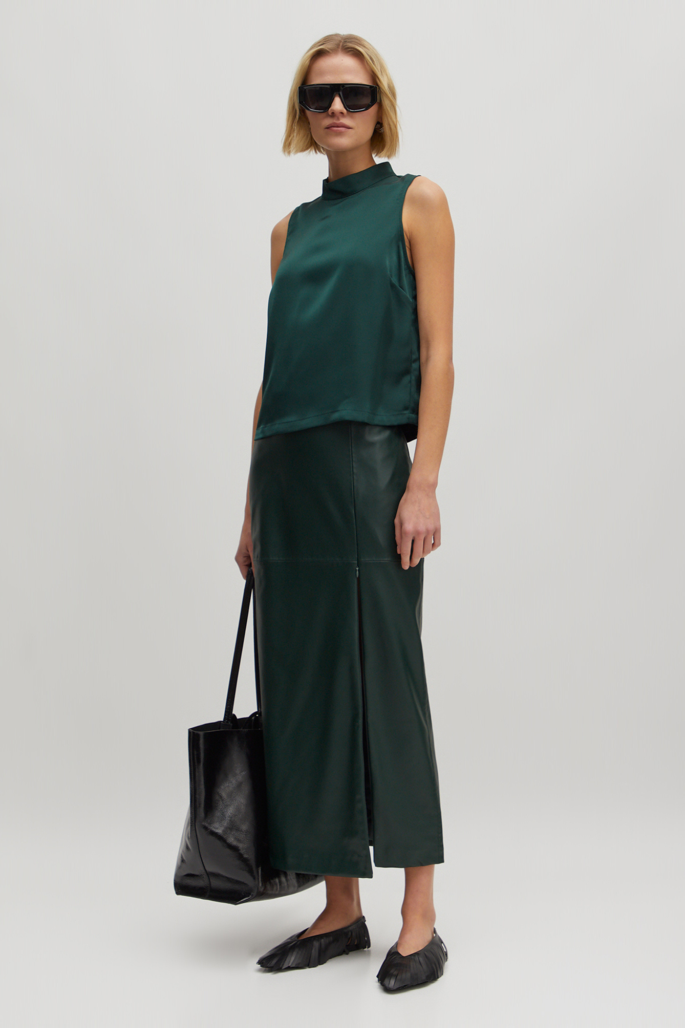 Model wearing the Edited Florin skirt in green. Front view