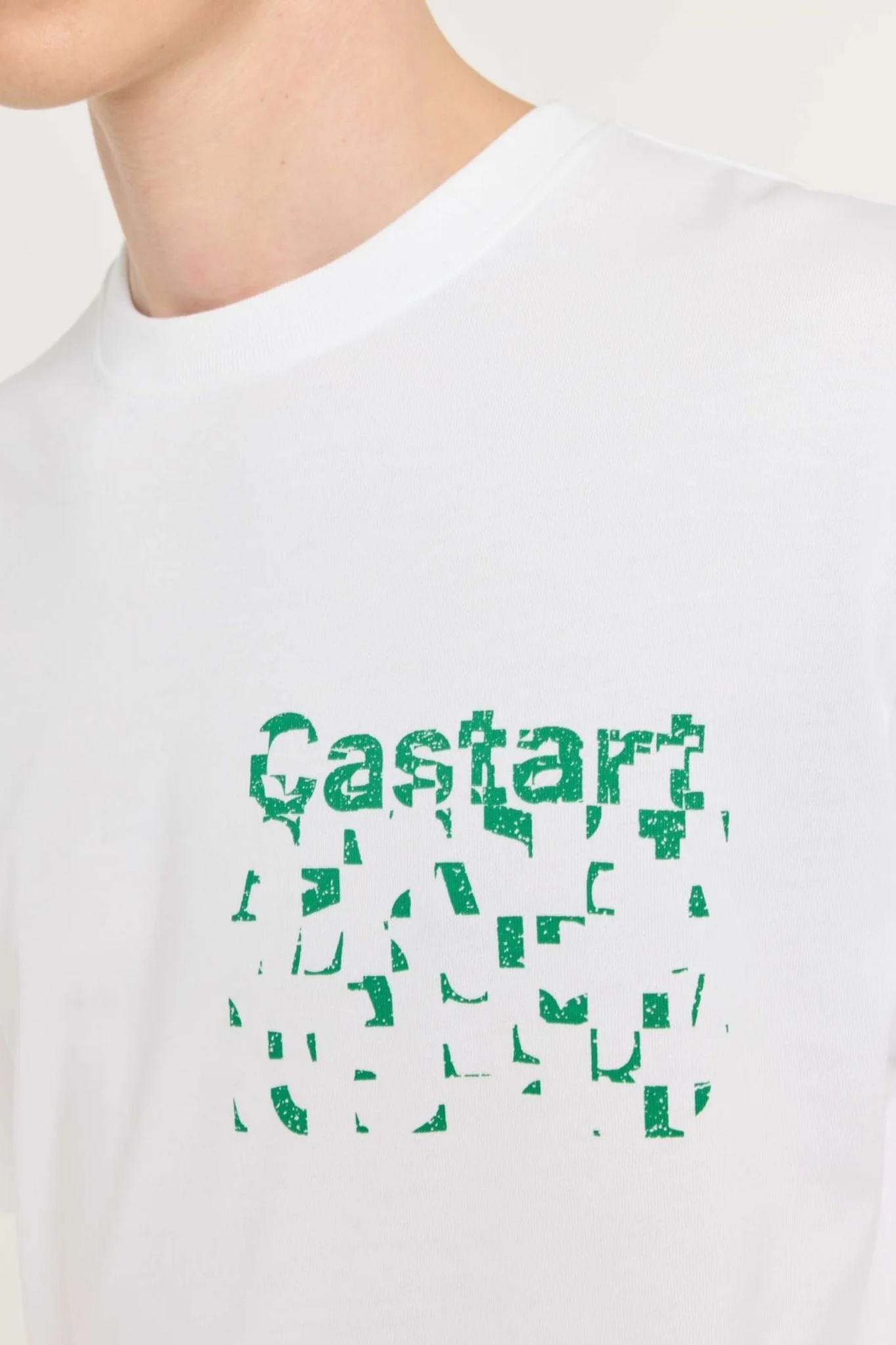 Model wearing the Castart haiku t-shirt in white and graphic in green. Close logo view