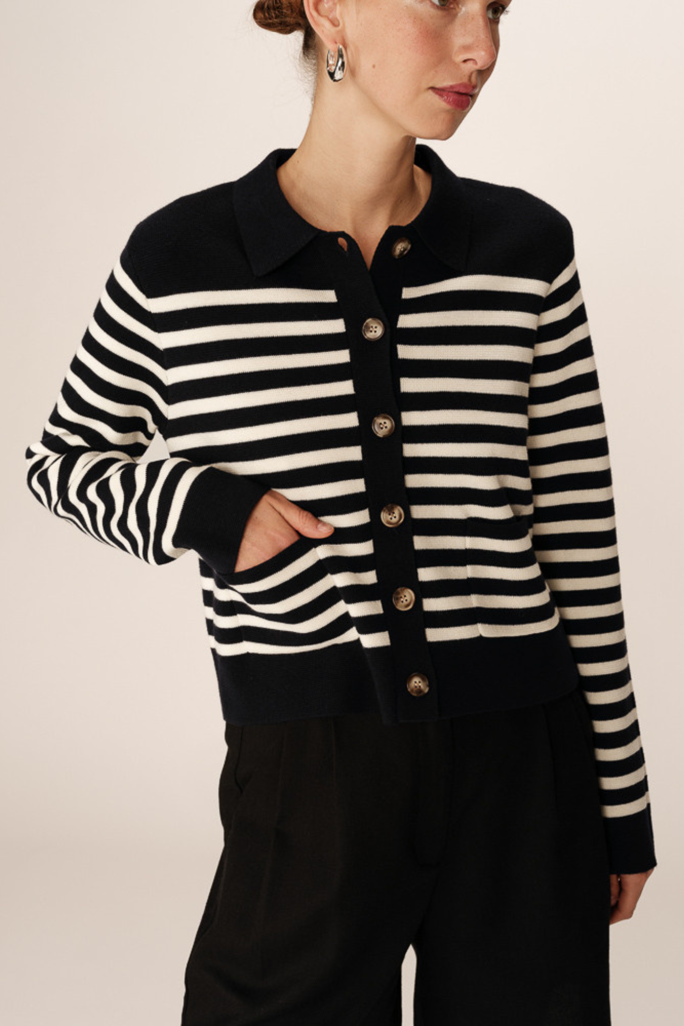 Model wearing the Grace & Mila pam cardigan in marine stripes in black and white. Front view