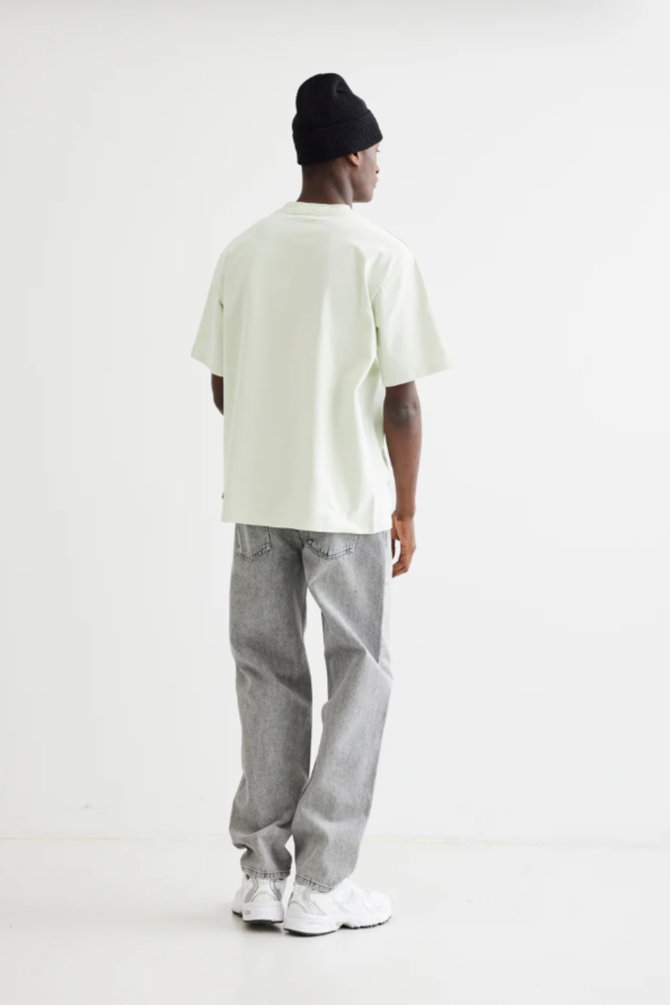 Model wearing the Woodbird Leroy ash grey jeans. Back view