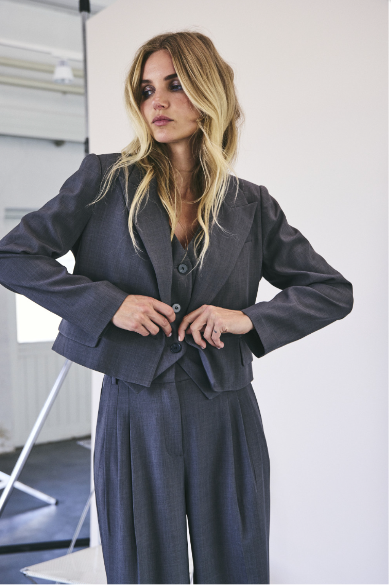 Model wearing the Co'Couture dark grey blazer. Front view