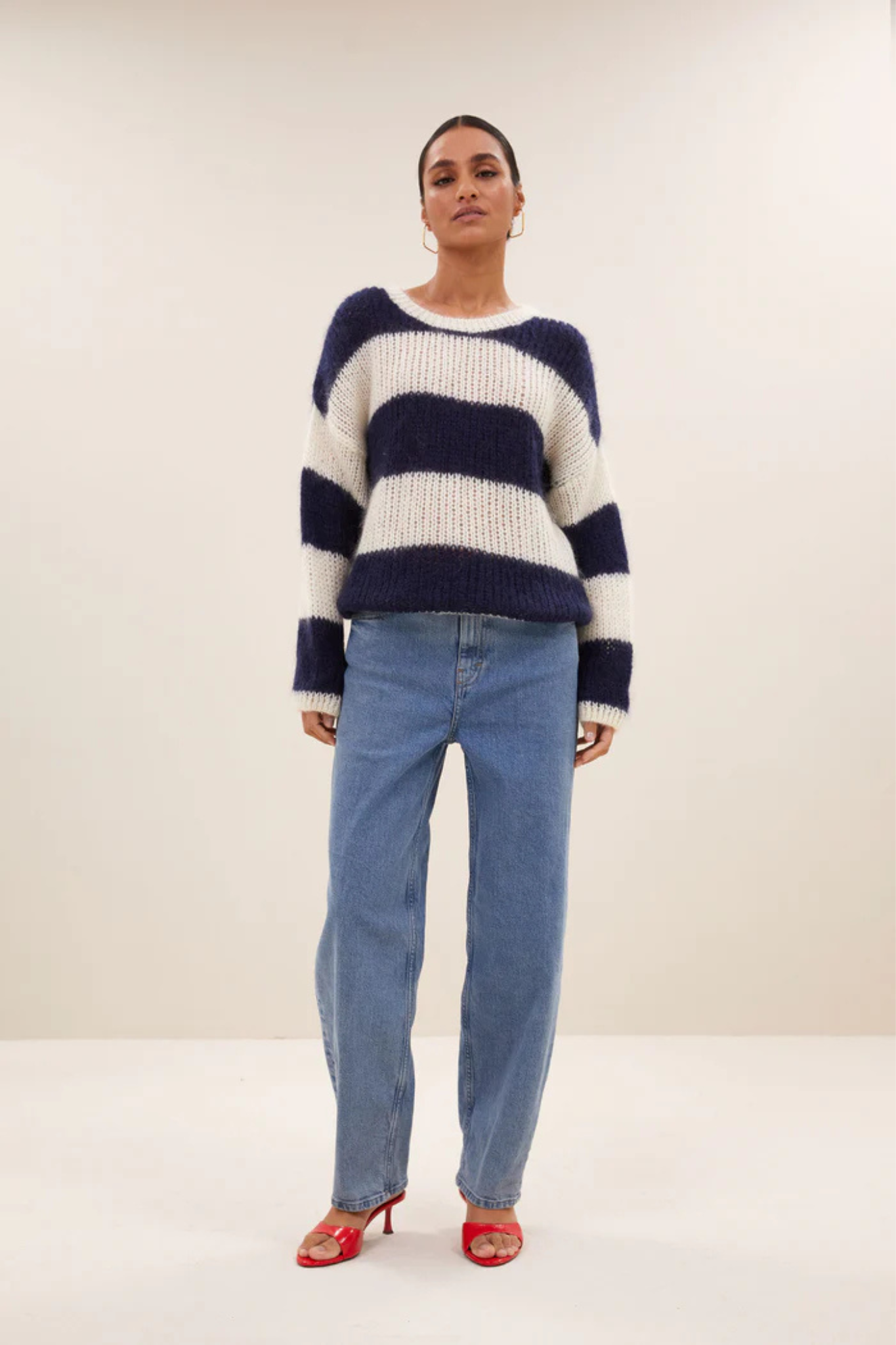 Model wearing the By-Bar Evi striped pullover in white and blue. Front view