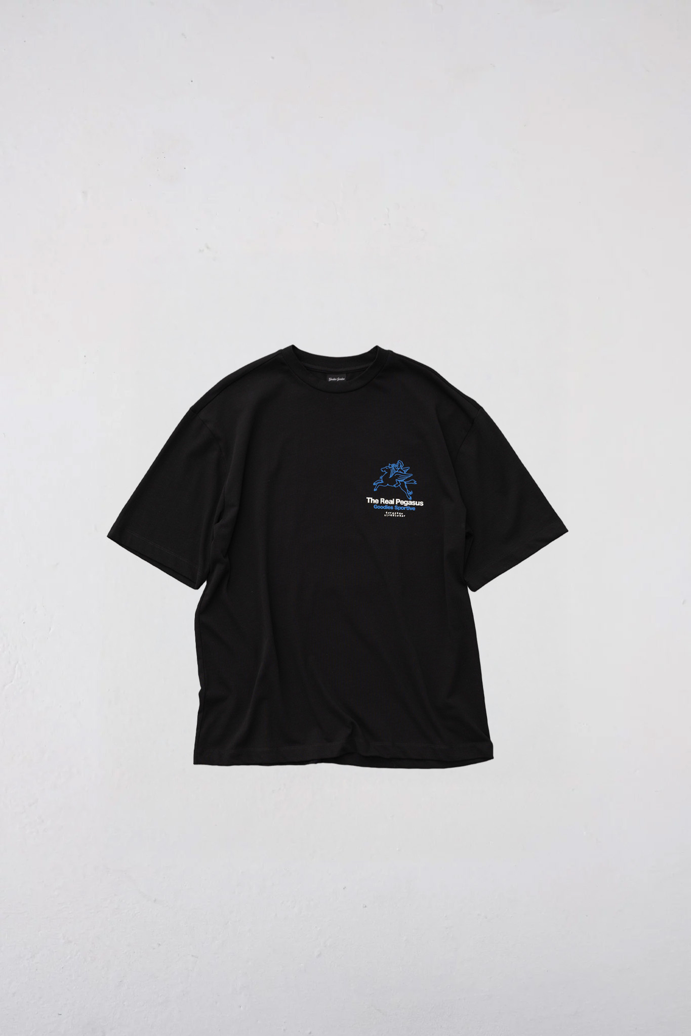 Goodies Sportive real pegasus t-shirt in black and graphic in blue. Front flatlay view