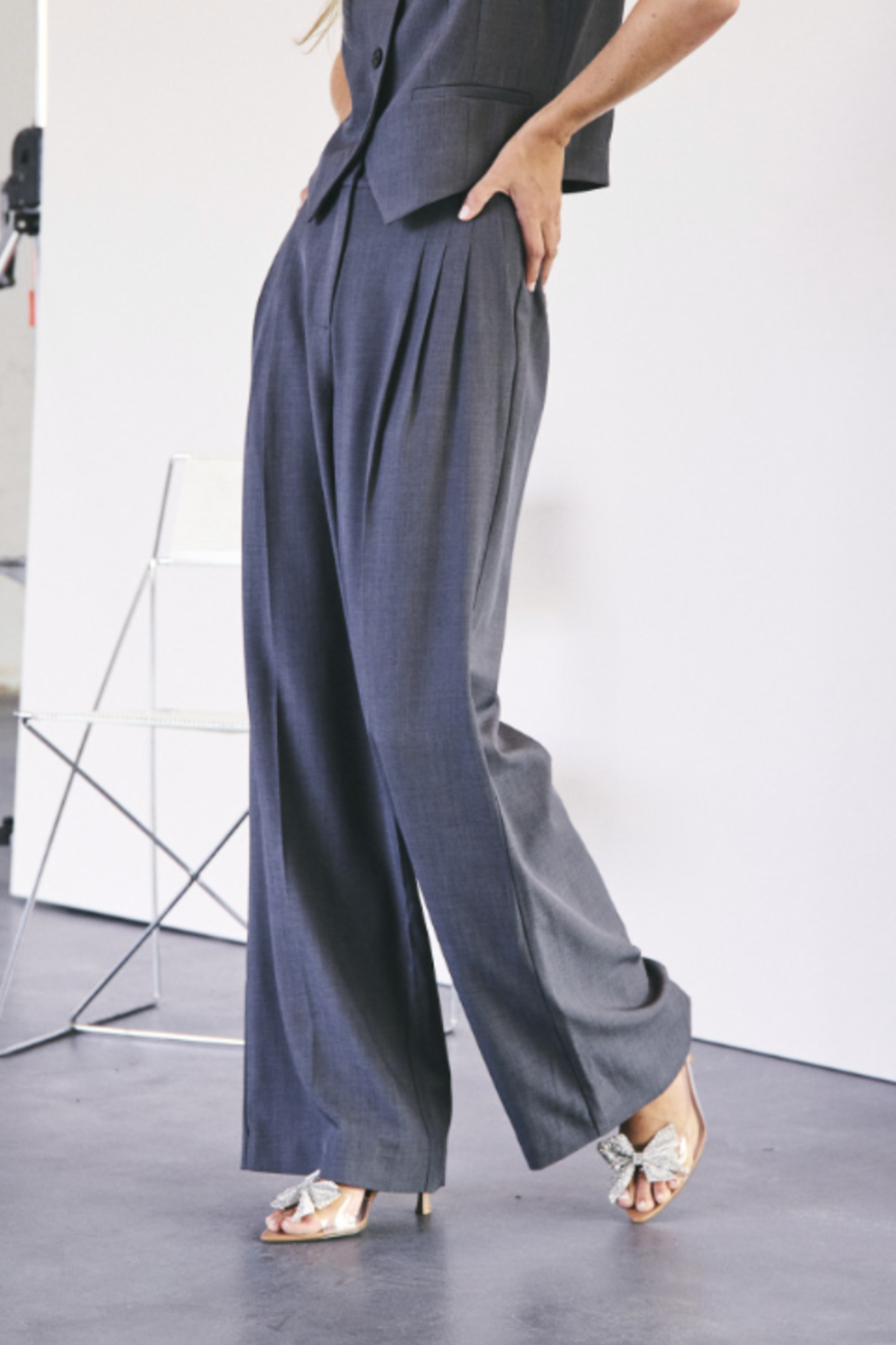 Model wearing the Co'Couture dark grey pleat wide pants. Front view