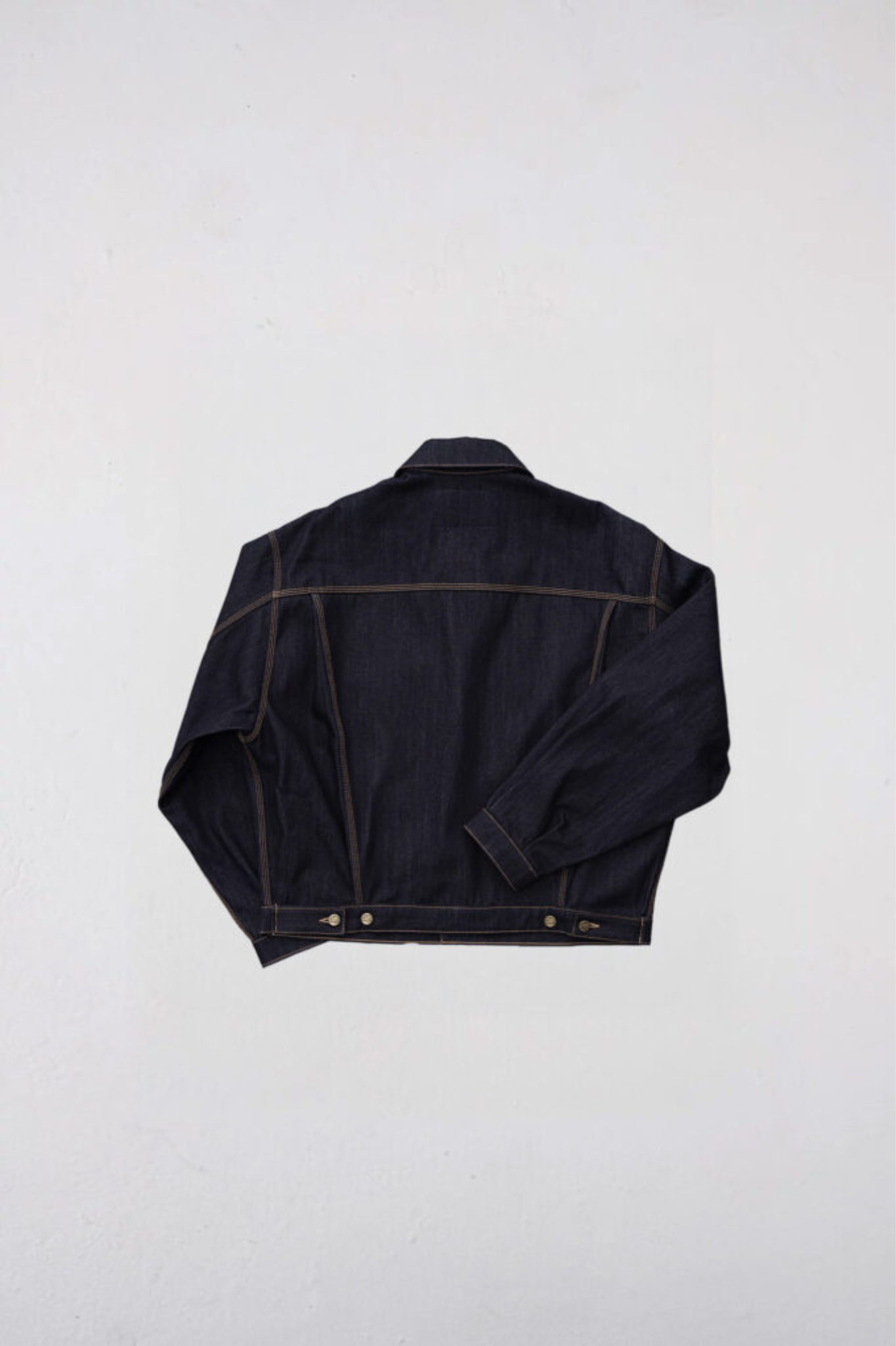 Goodies Sportive raw denim trucker jacket in denim. Back flatlay view