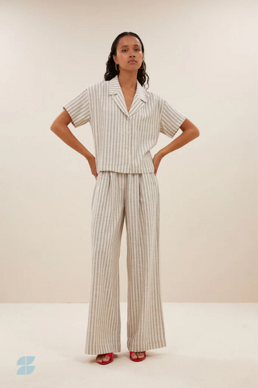 Model wearing the By-Bar Benji striped marine pants in beige and white. Front view