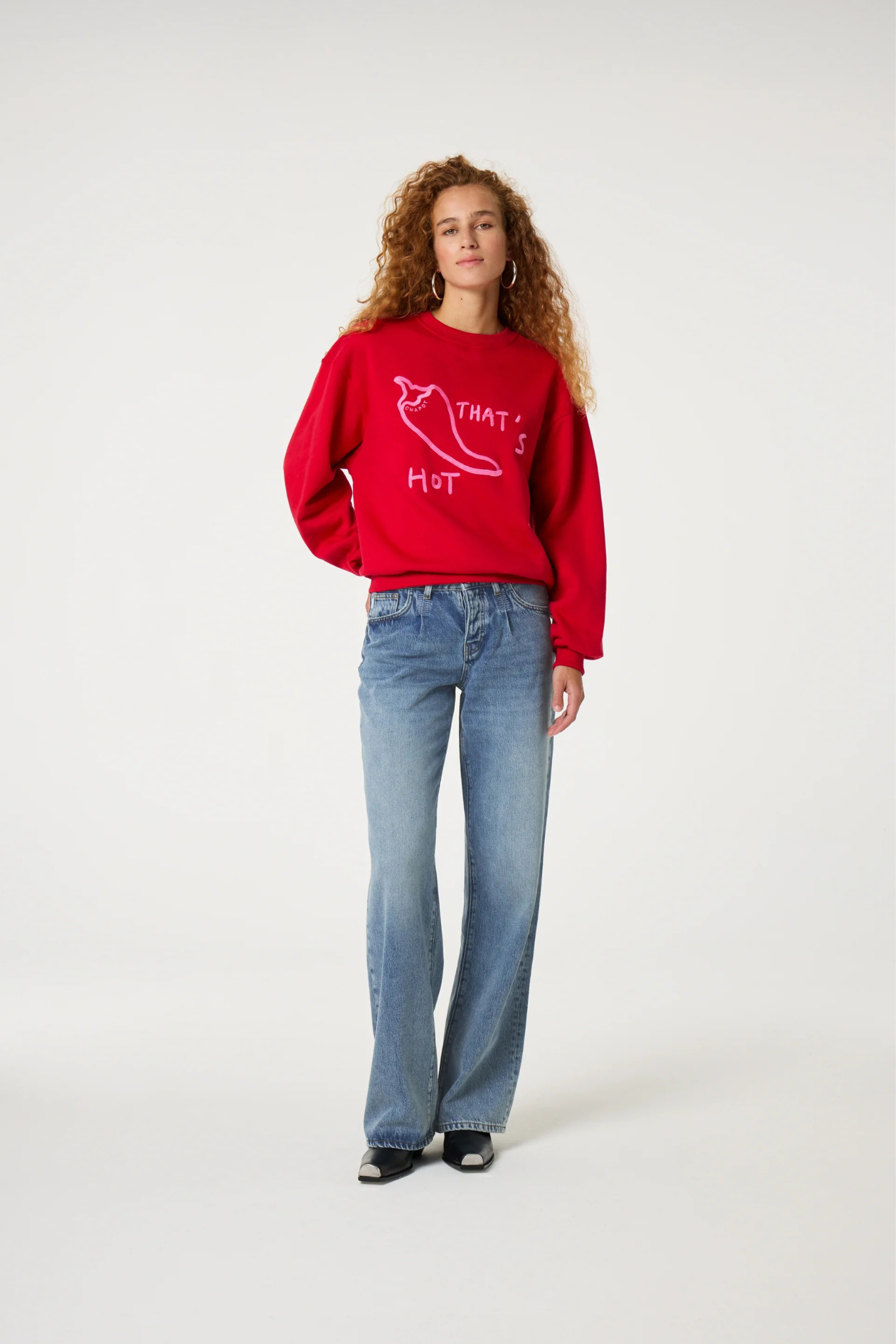 Model wearing the Fabienne Chapot Terry chili sweater in red. Front view