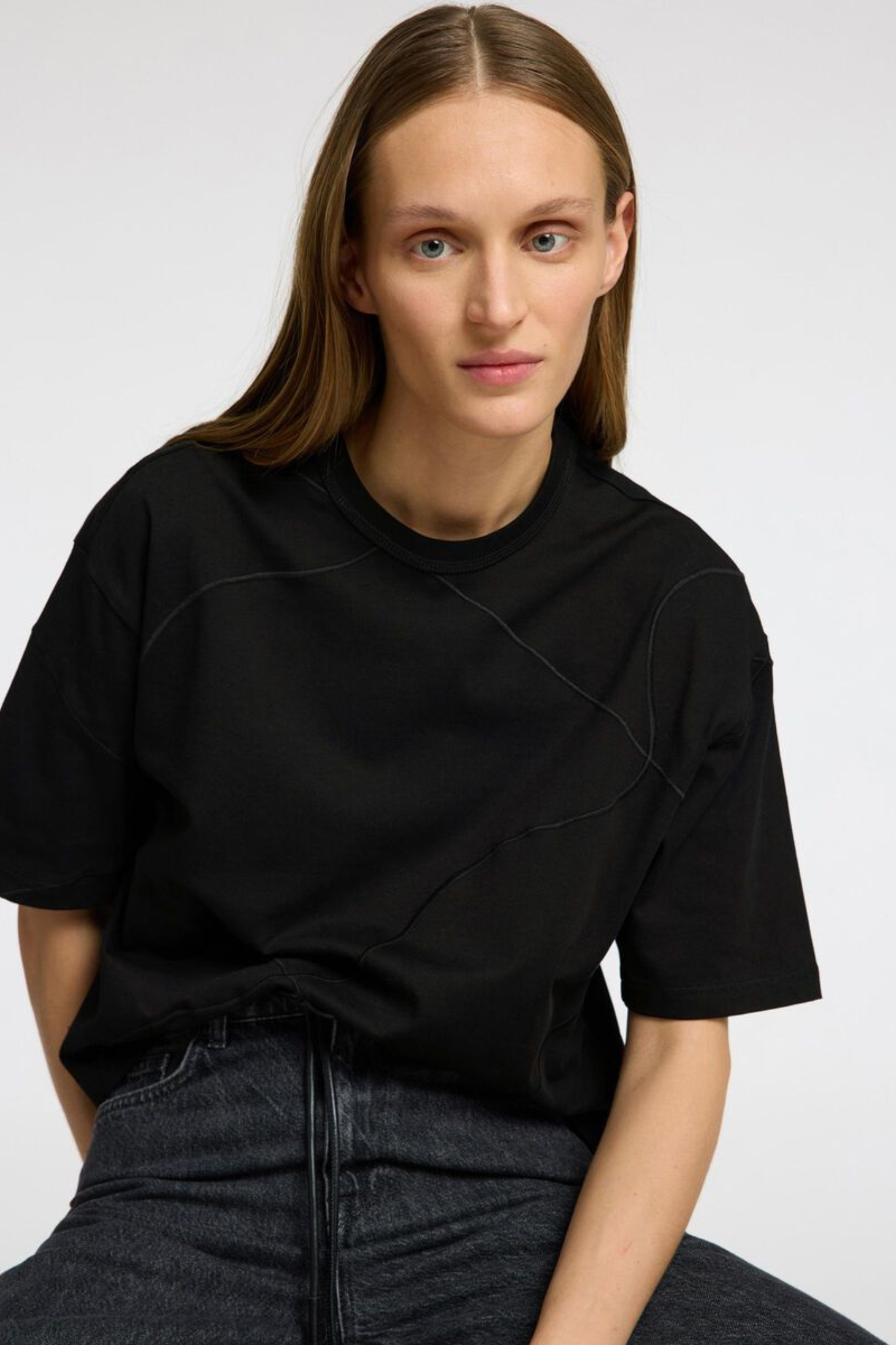 Model wearing the Selected Femme penny embroidered tee in black. Front view