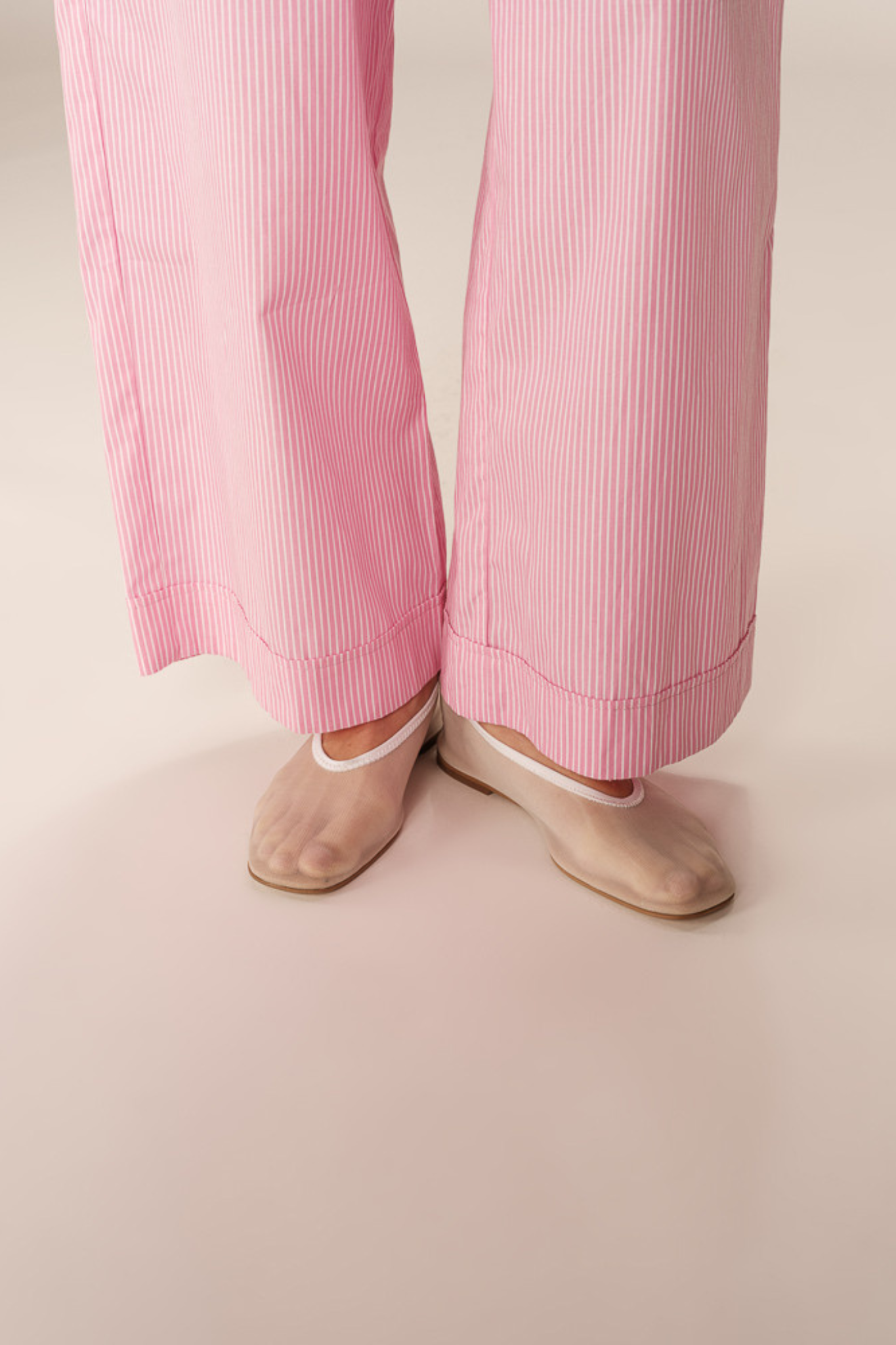 Model wearing the Grace & Mila parmentier pants in pink. Close front view