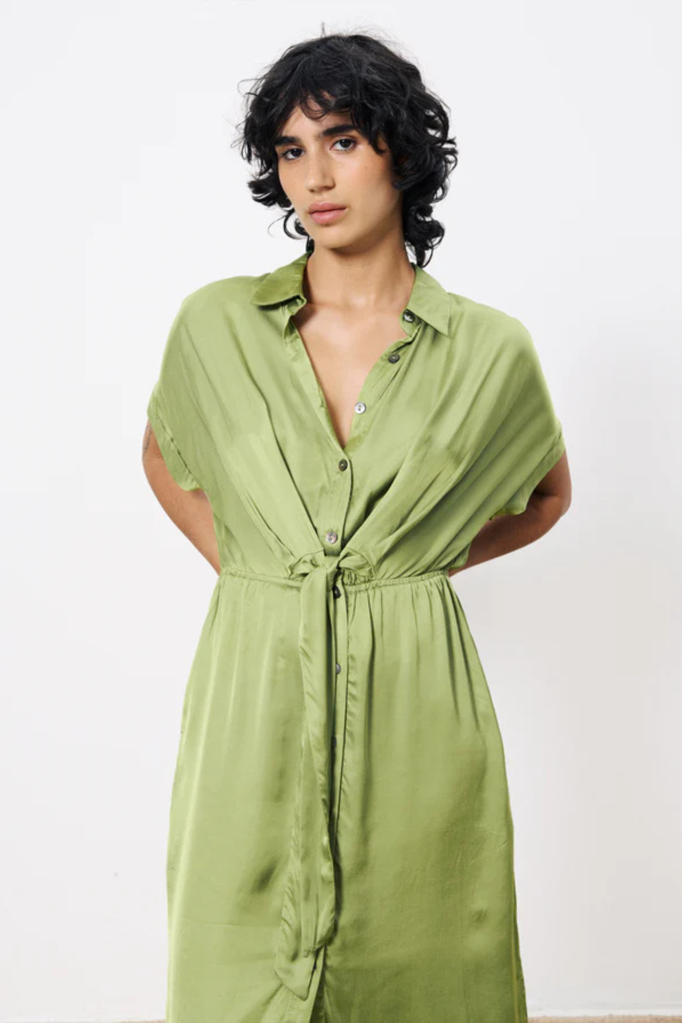 Model wearing the FRNCH estee dress in green. Front view