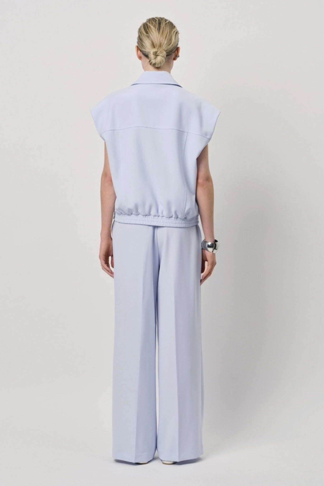 Model wearing the Dante6 fabri elasticated wide leg pants in light blue. Back view