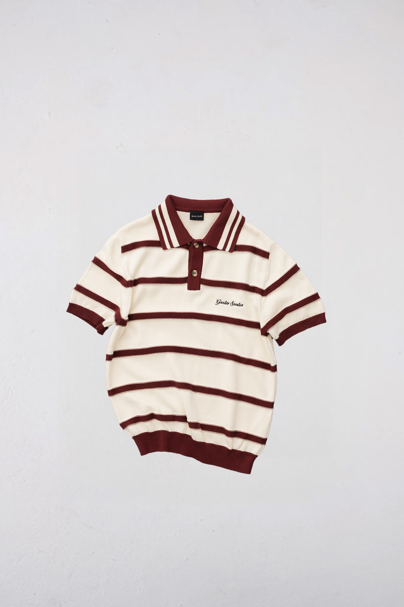 Goodies Sportive plum polo shirt in ecru and burgundy. Front flatlay view