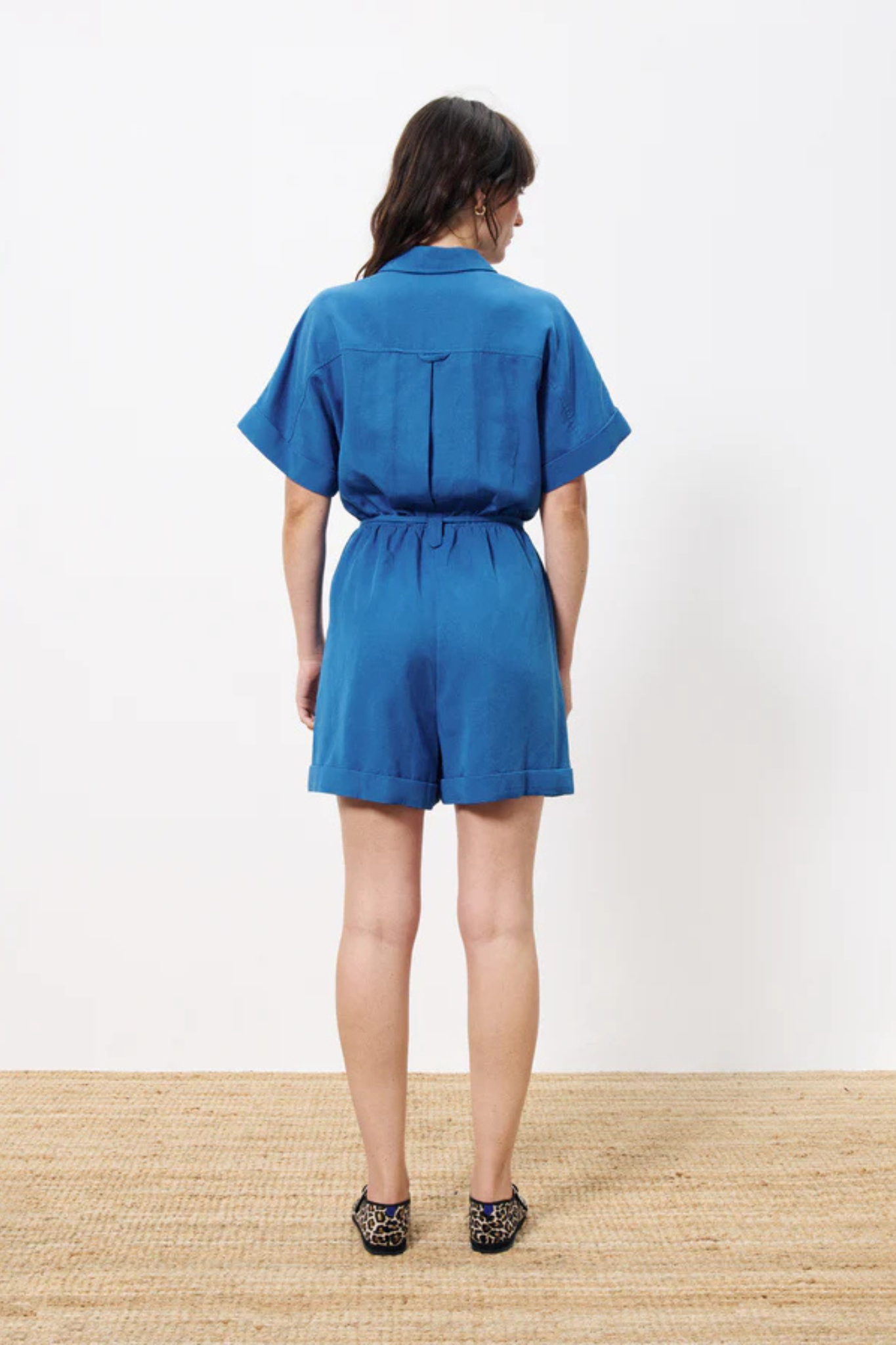 Model wearing the FRNCH lily combishort in blue. Back view