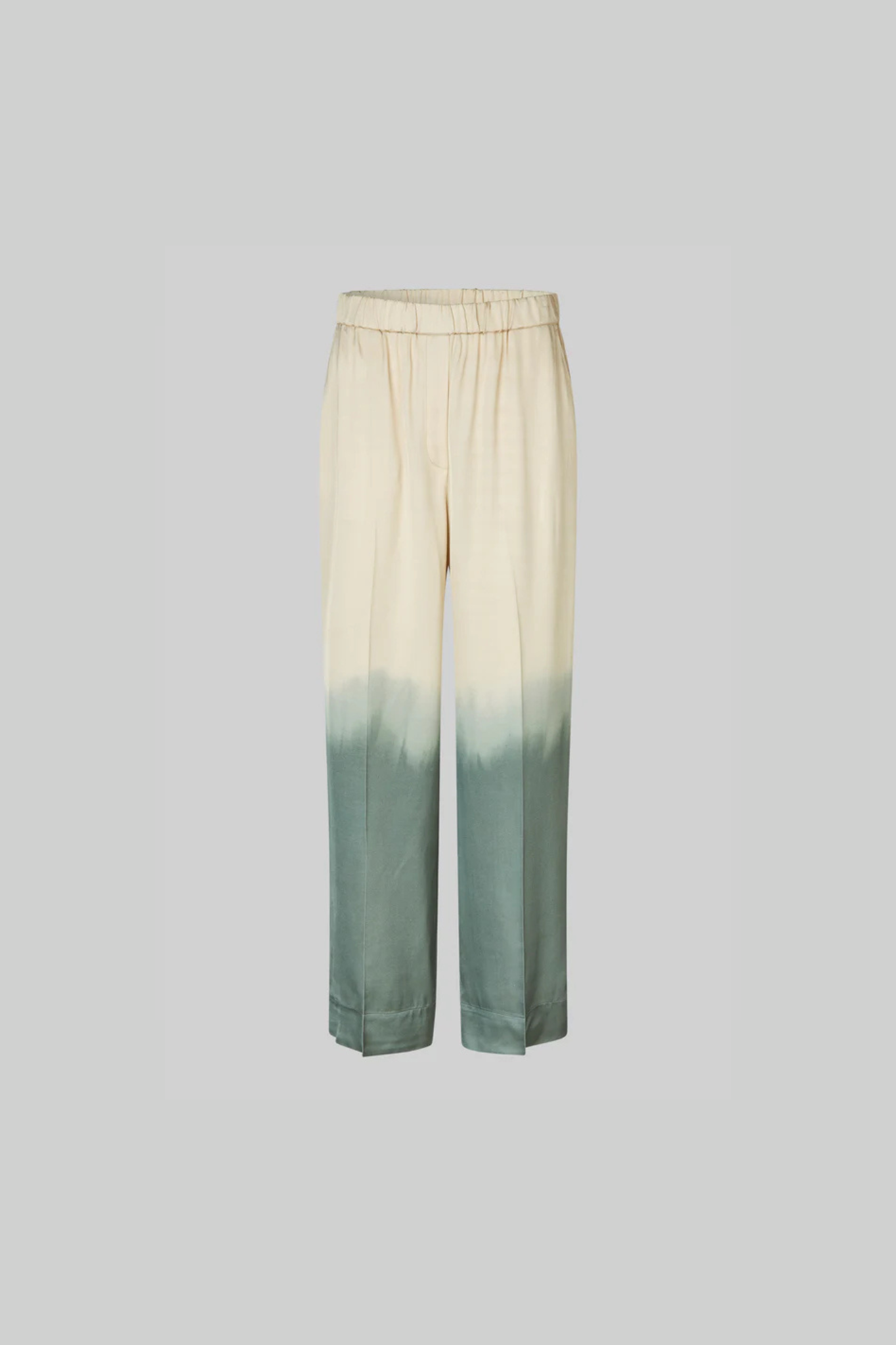 Second Female avora pants in beige and green. Front flatlay view